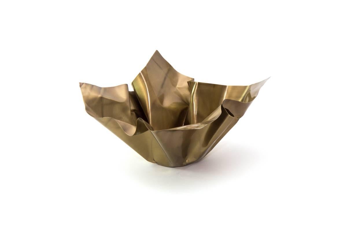 The Paper Series embodies the idea of crumpling paper set in time. The materiality of the brass is utilized by the intricate folds and bends that not only resemble paper, but adds structure to the bowl. Each Paper is unique and hand-sculpted in