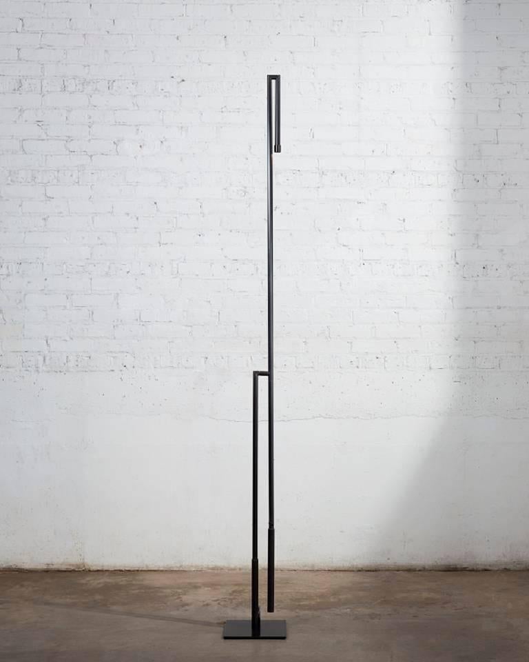 Floor lamp in darkened brass with LED. Custom finishes available.
