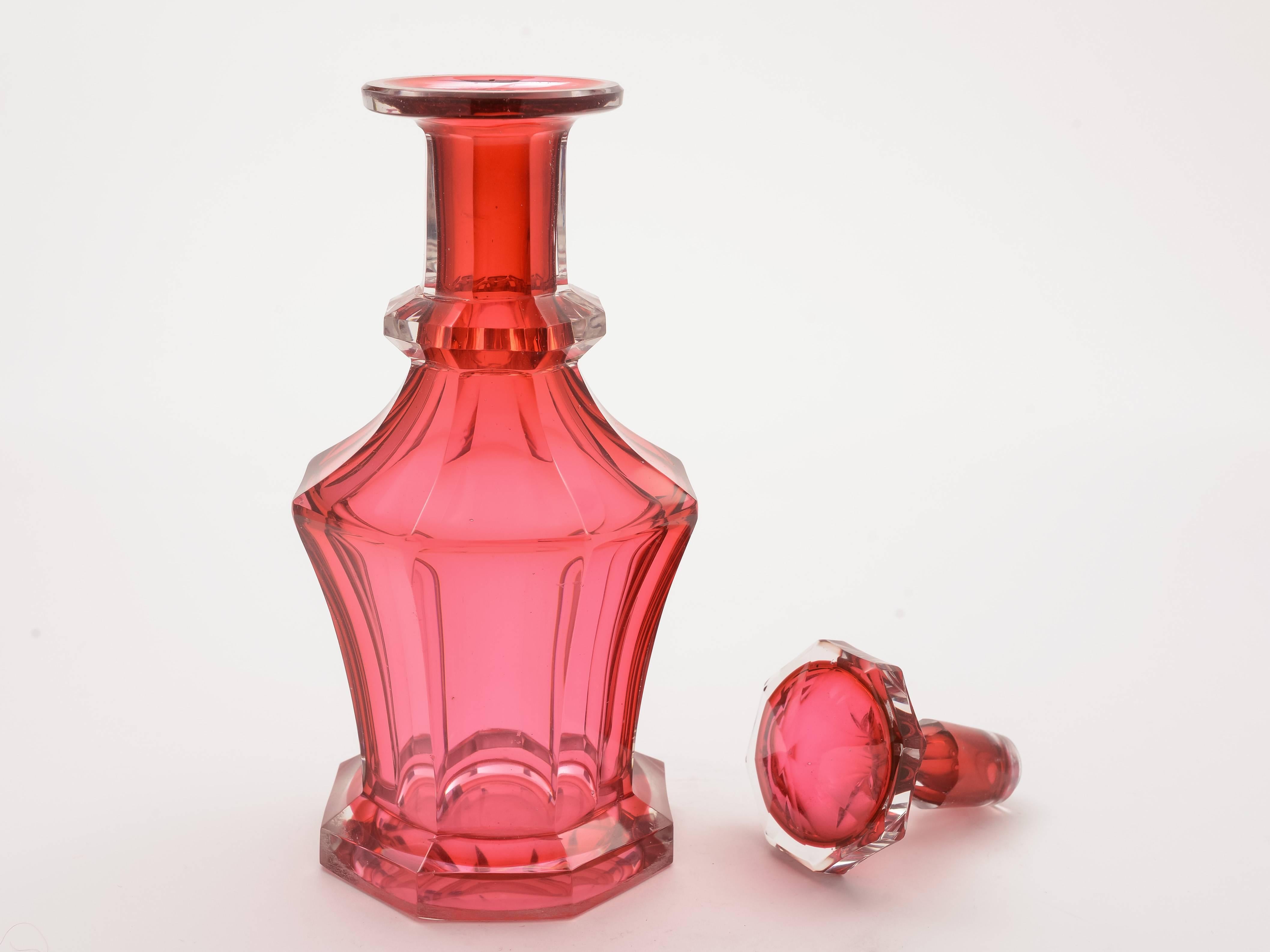 A stunning and rare, early Victorian English cranberry glass decanter in eight-sided panel cut design and with original stopper, circa 1840.

Measurements: Height 8 inches; (approximate 20cm)
Diameter across base 3 inches; (approximate