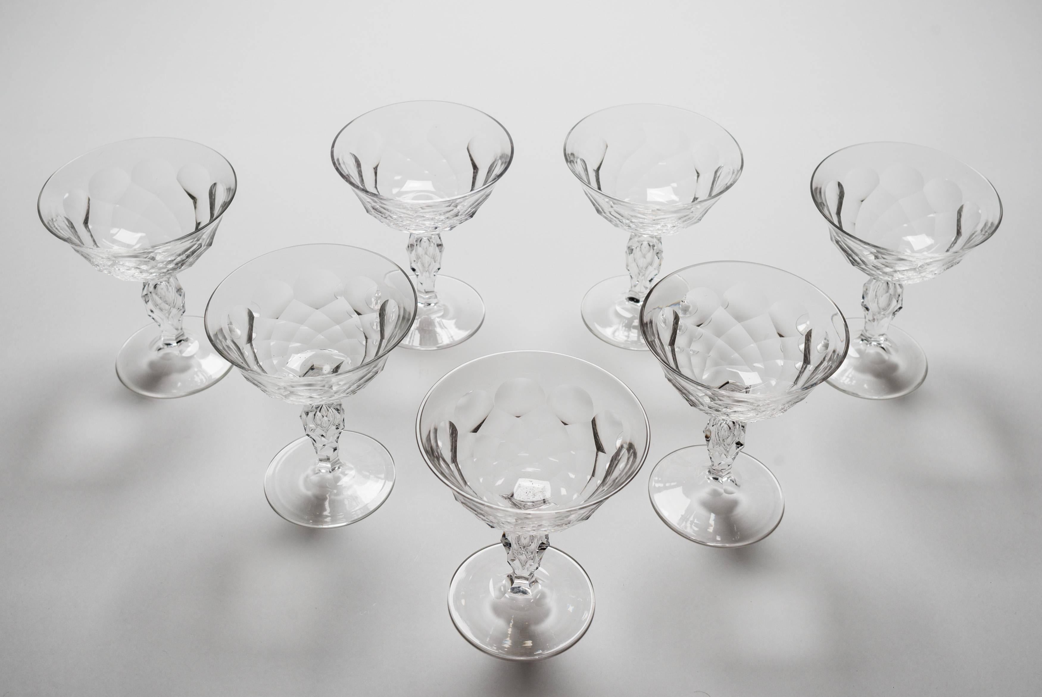 A lovely set of seven English champagne glasses with slice cut decoration and hollow stems, circa 1920.

Measures: Total weight 1512g

 