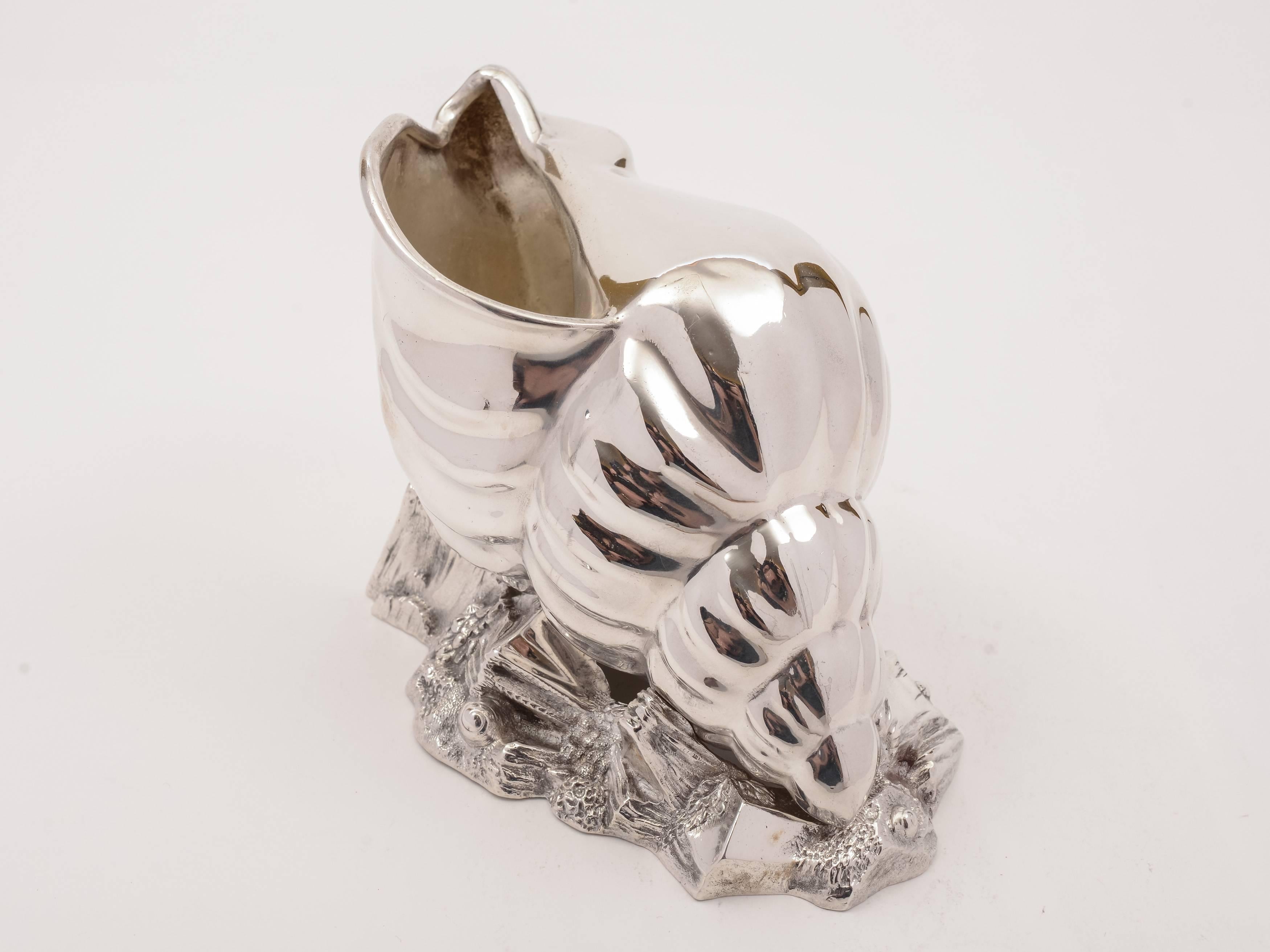 A fabulous English Victorian silver plated seashell-shaped spoon warmer which sits on rocky base and is embossed with shells and seaweed, circa 1880 and marked 'HA EA FA' for maker Atkin Brothers, Truro Works.

Weight: 578g.
  