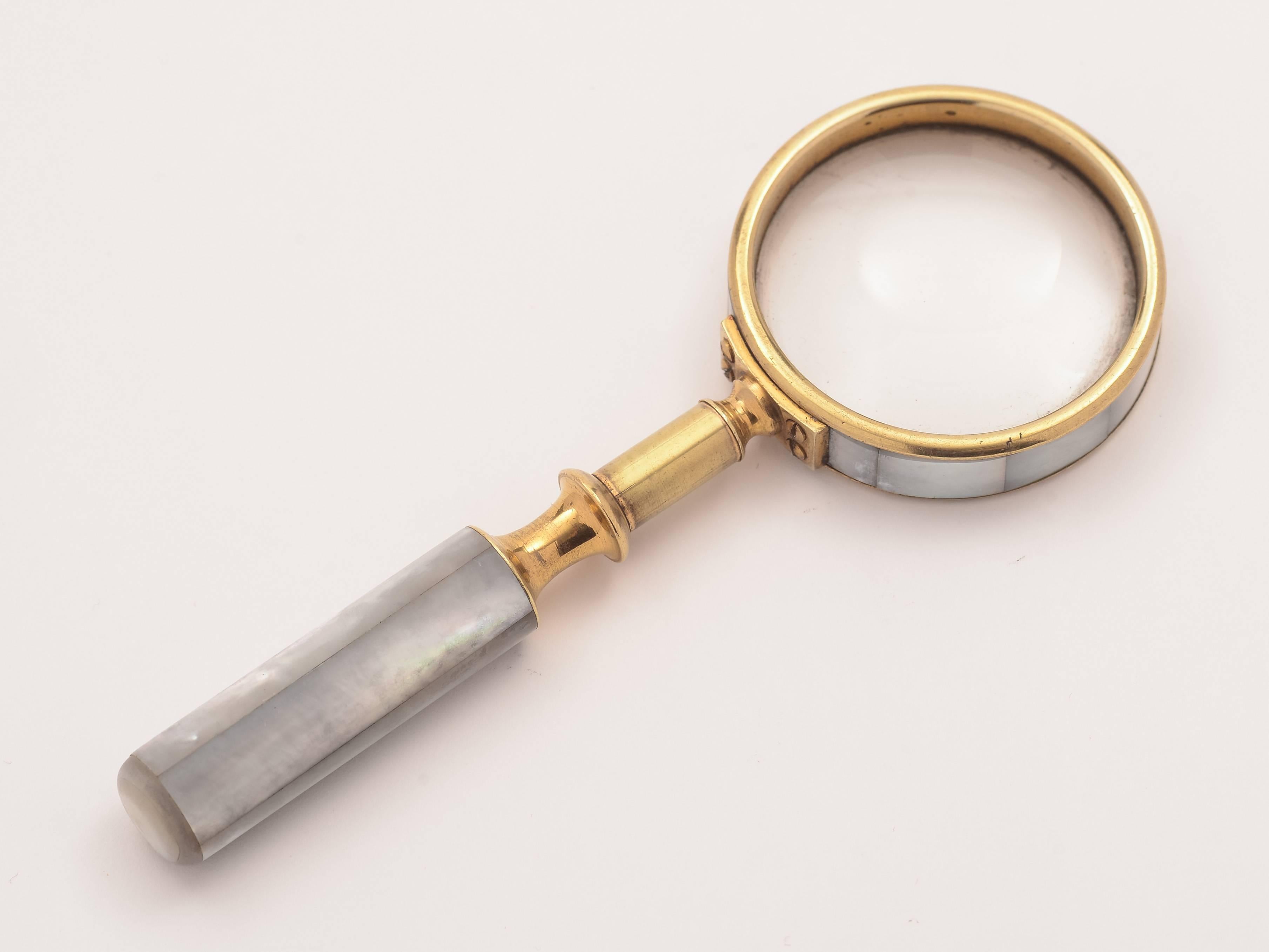 A nice small English Edwardian mother-of-pearl and brass magnifying glass, circa 1905.

Weight: 57 g.
  