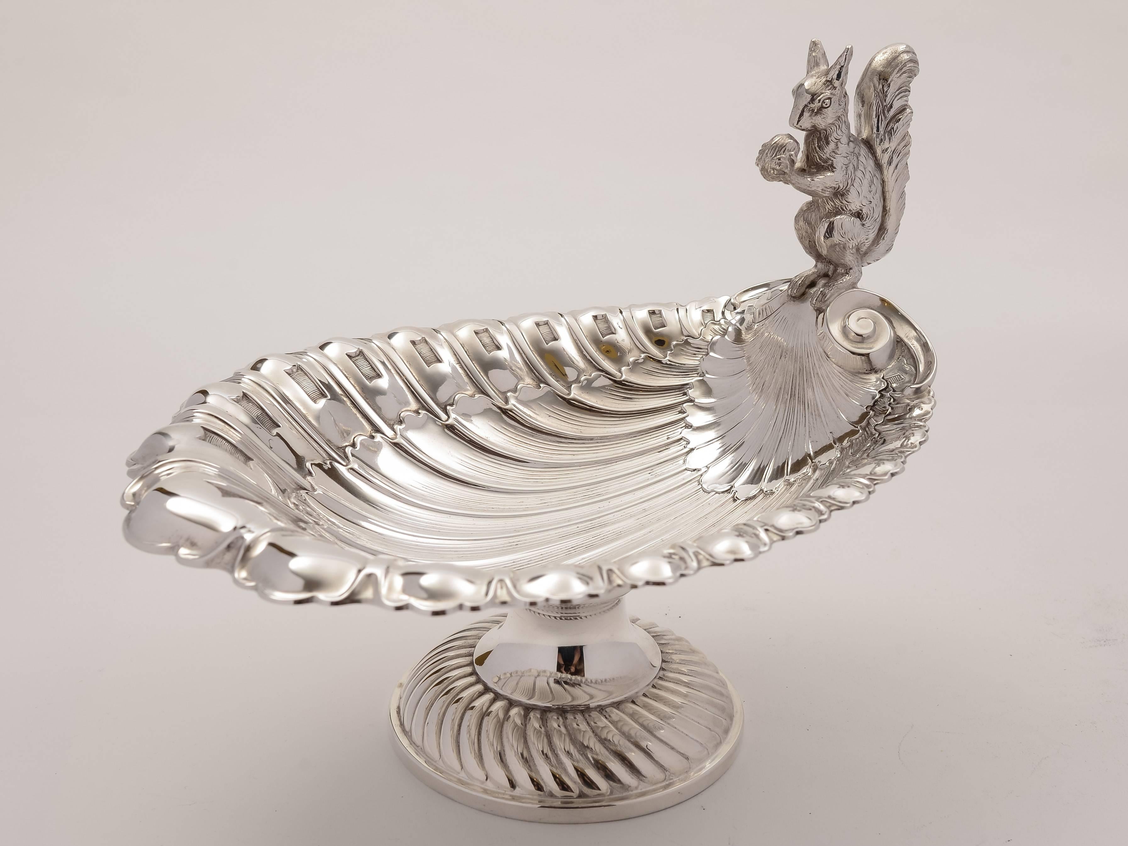 A lovely WMF German silver plated squirrel nut serving dish with fluted decoration and squirrel perched at one end, circa 1910.

Total weight: 772g.

