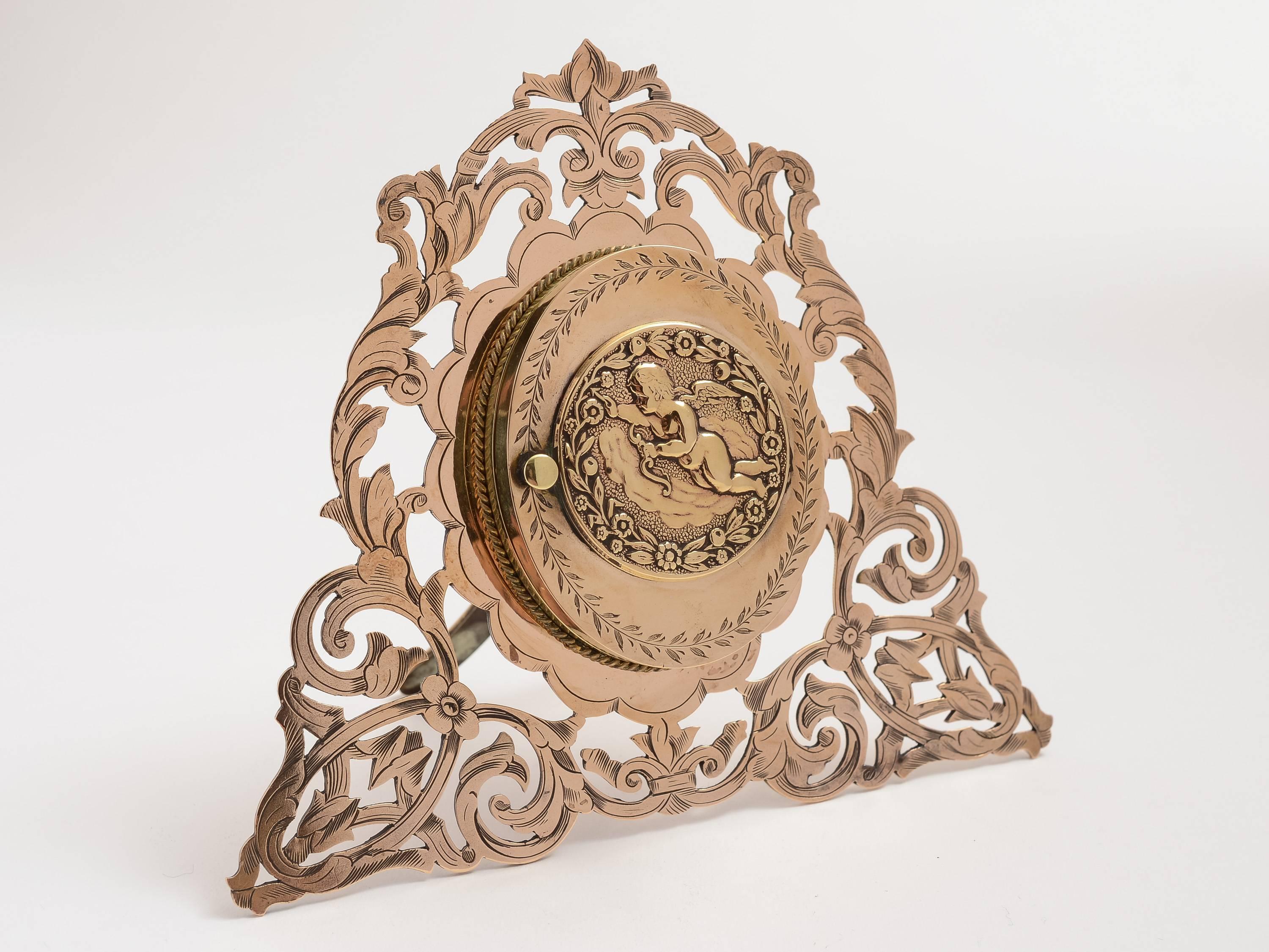 Beautiful Victorian double photograph frame in polished bronze and brass with easel back. Lovely engraved decoration with embossed cupid to the front, which opens to reveal two photograph frames, circa 1880.

Total weight approx 357 g.

  