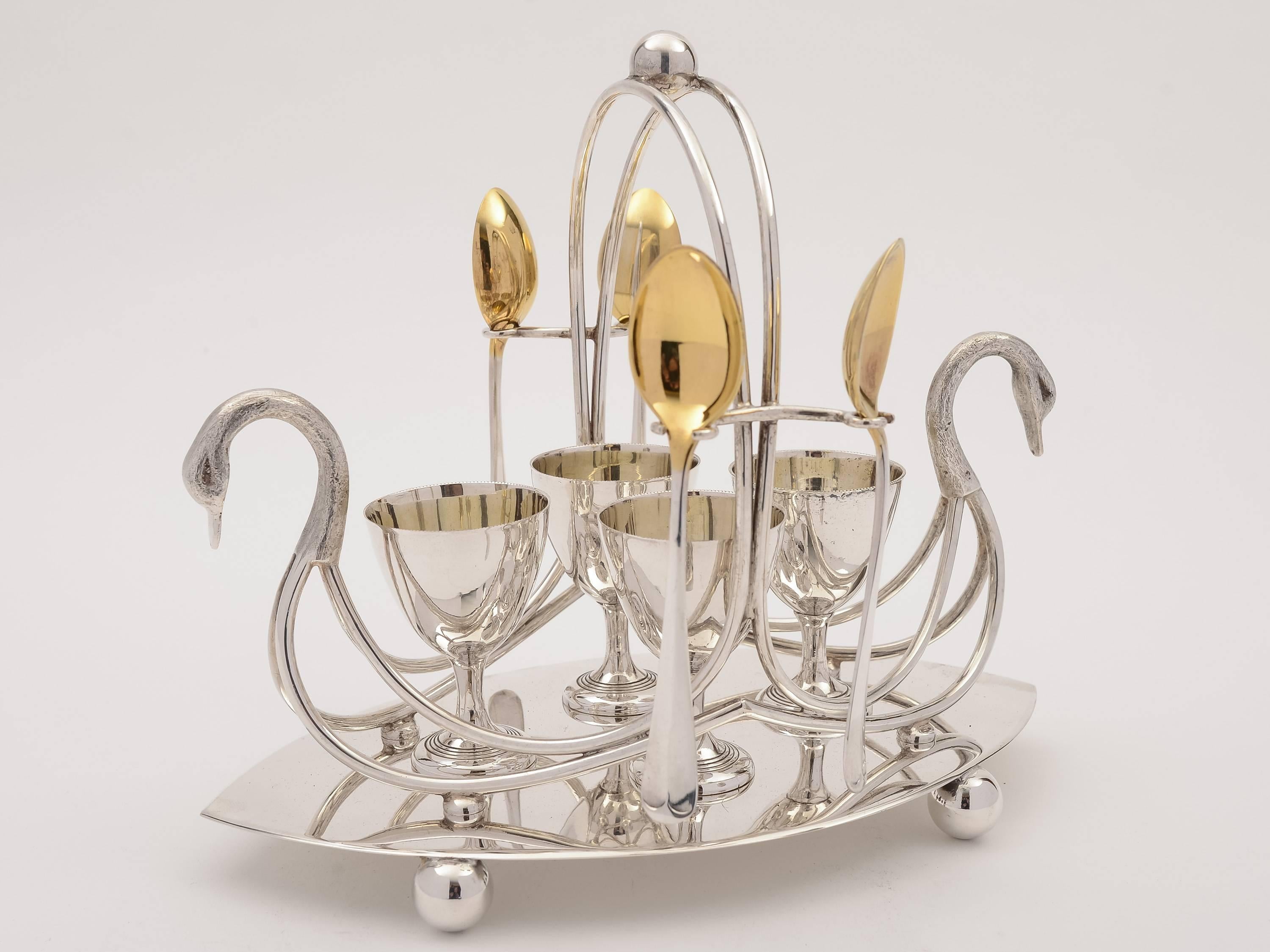 A wonderful and unusual silver plated, four-person egg cruet with swan decoration at each end. Base stands on ball feet with four egg cups and matching spoons, circa 1900, maker is 'G. B & S' - George Bowen & Son, Victorian Works,