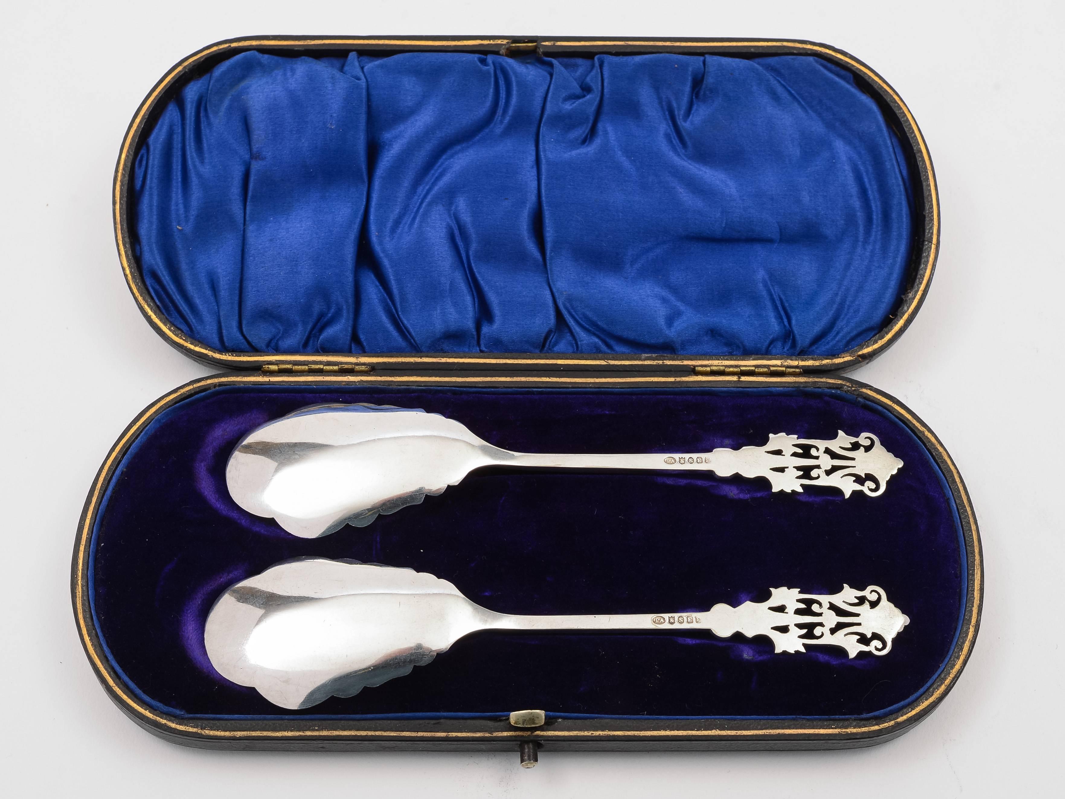 A lovely pair of English Victorian silver plated preserve spoons with pierced and engraved decoration, presented in original velvet and silk lined box. Maker is Philip Ashbury & Sons, Sheffield, England, circa 1890.

An exceptionally nice pair of