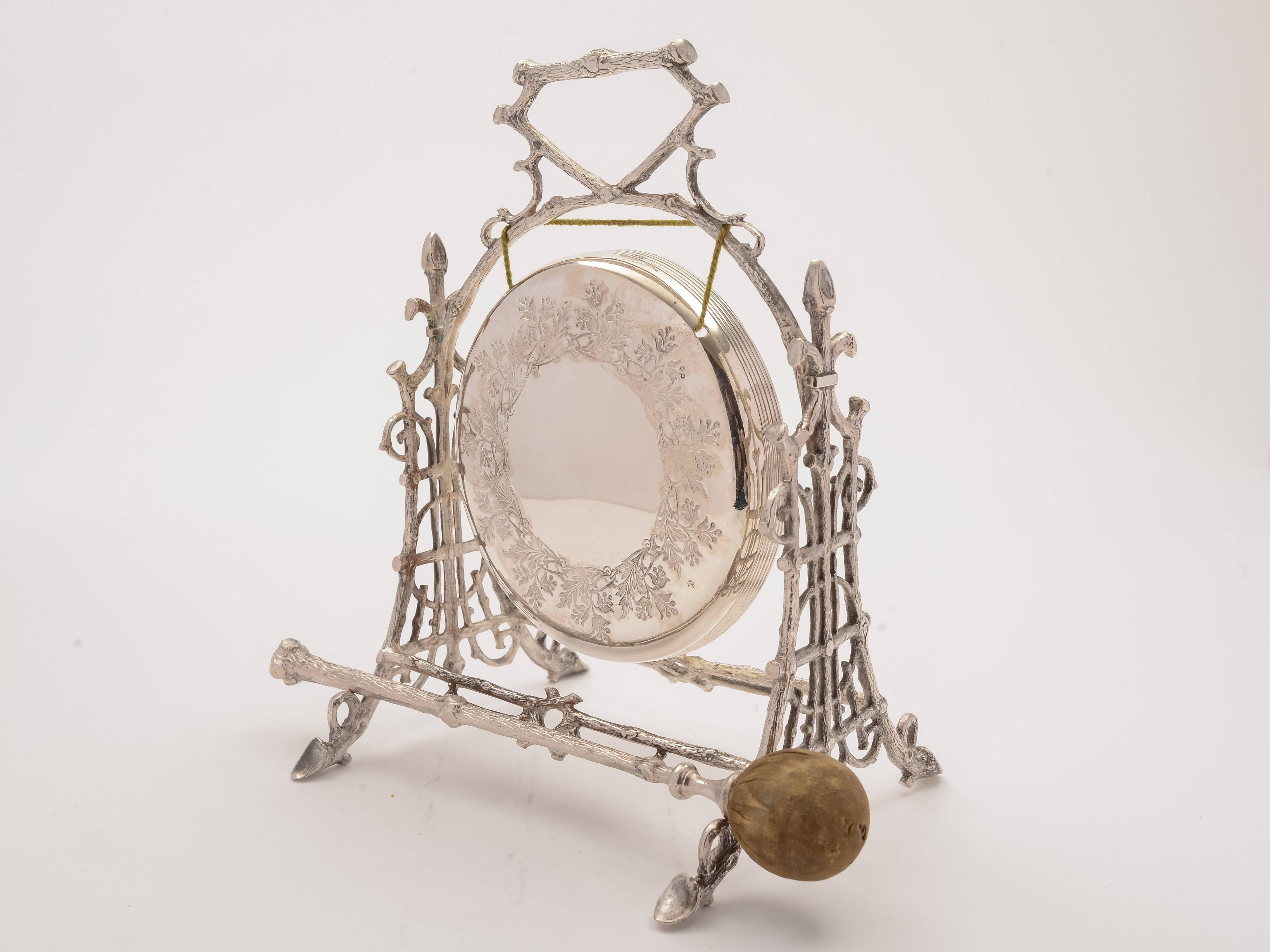 A charming English Victorian silver plated dinner gong with decorative embossed frame and beautiful engraved decoration to gong, it also comes with its' original striker (gong makes a good sound), circa 1890.

Total weight: 639g.

 
