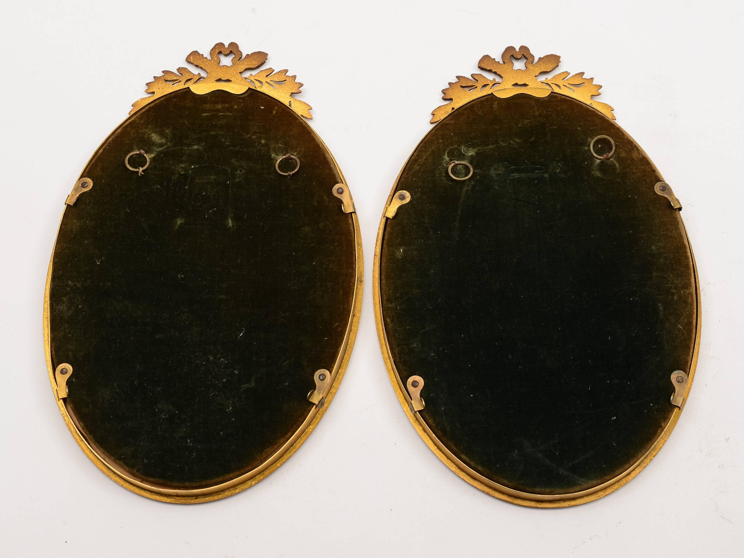 A beautiful pair of French brass mirrors with cast and pierced decorative tops and eyes to the back for ease of hanging, circa 1910.

Weight: 430g each.

 