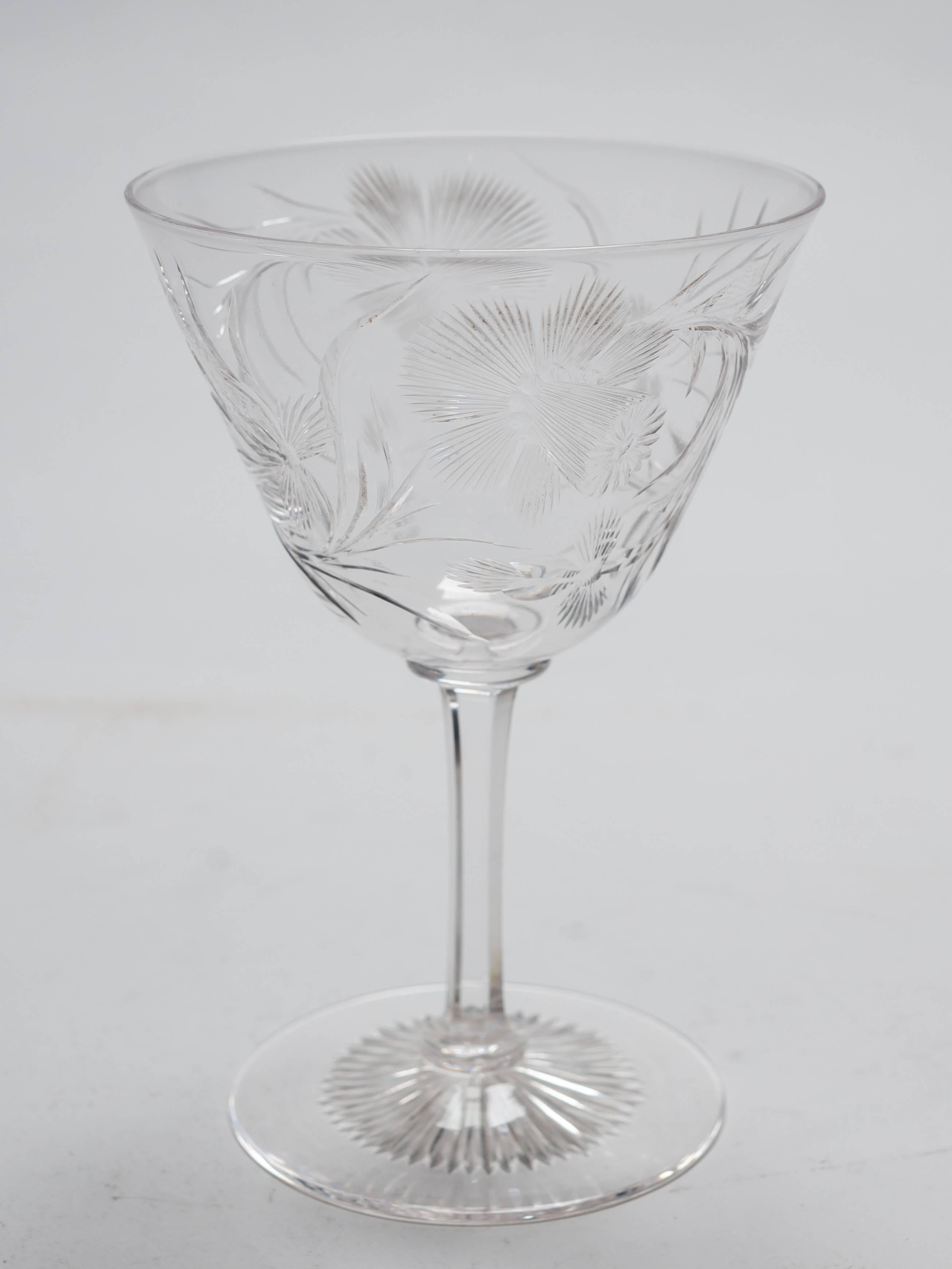 A beautiful English Edwardian set of eight wine glasses with lovely intaglio flower cut-glass decoration and sit on plain stems, circa 1905.

Measurements:
Height: 5