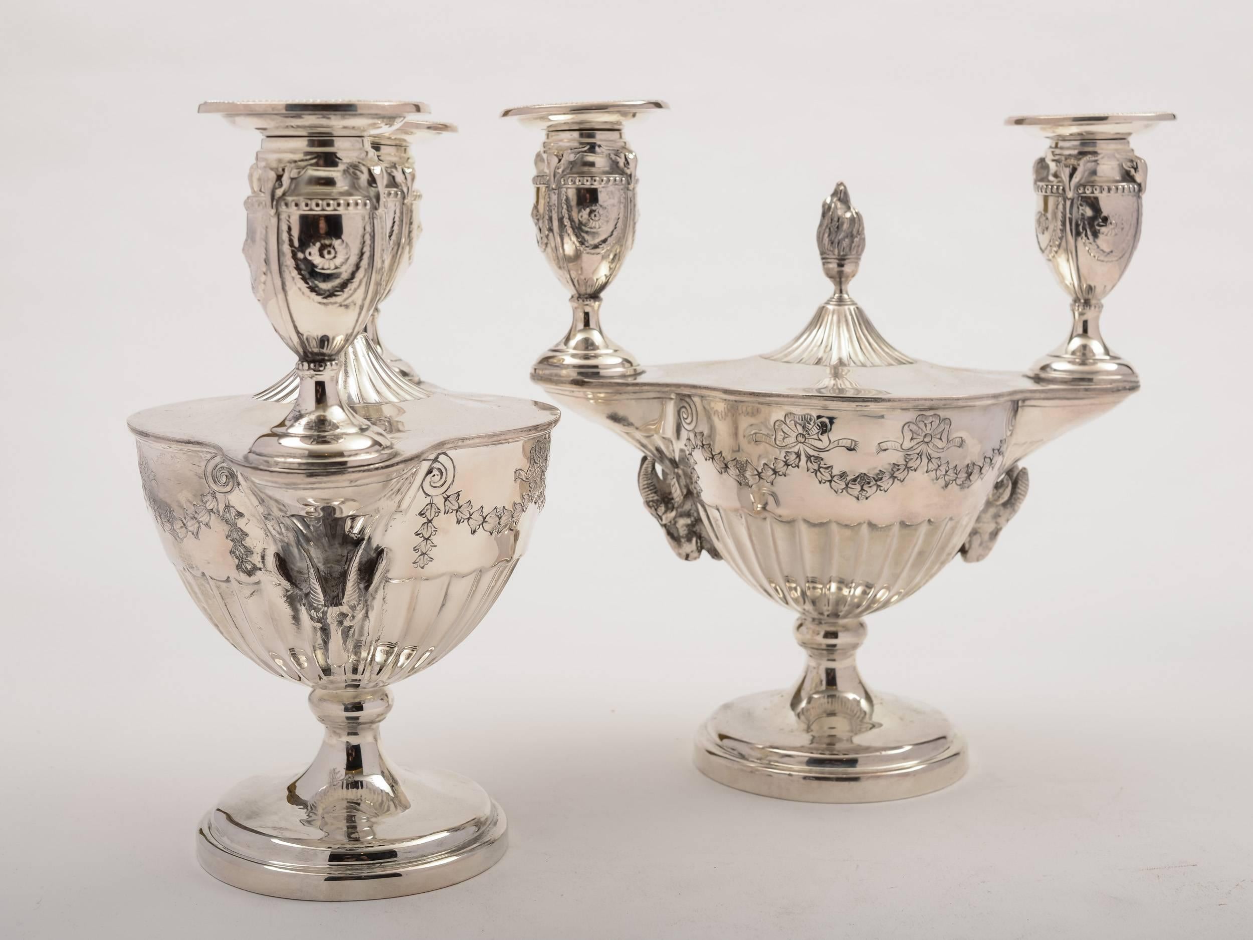 A stunning pair of English Victorian silver plated Adam style candelabras. Have rams head and embossed swag decoration, circa 1890 and made by the renowned maker, Mappin & Webb. This is the first pair we have had in this style for quite a long