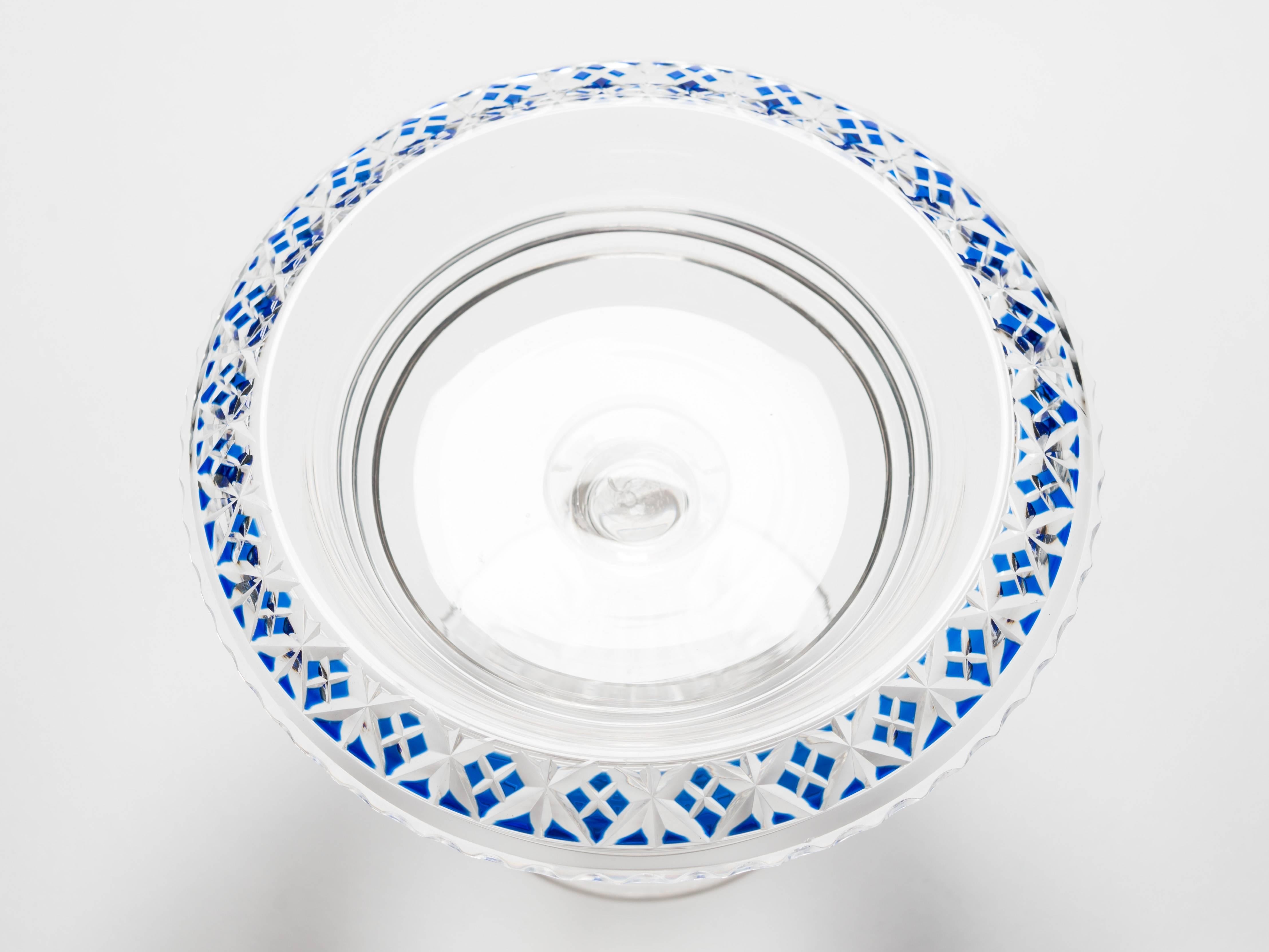 A sweet English Victorian cut-glass tazza with blue overlay decoration to border and hollow cut-glass step with star cut base, circa 1890. Ideal for sweetmeats etc.

Measurements: 
Height:
5