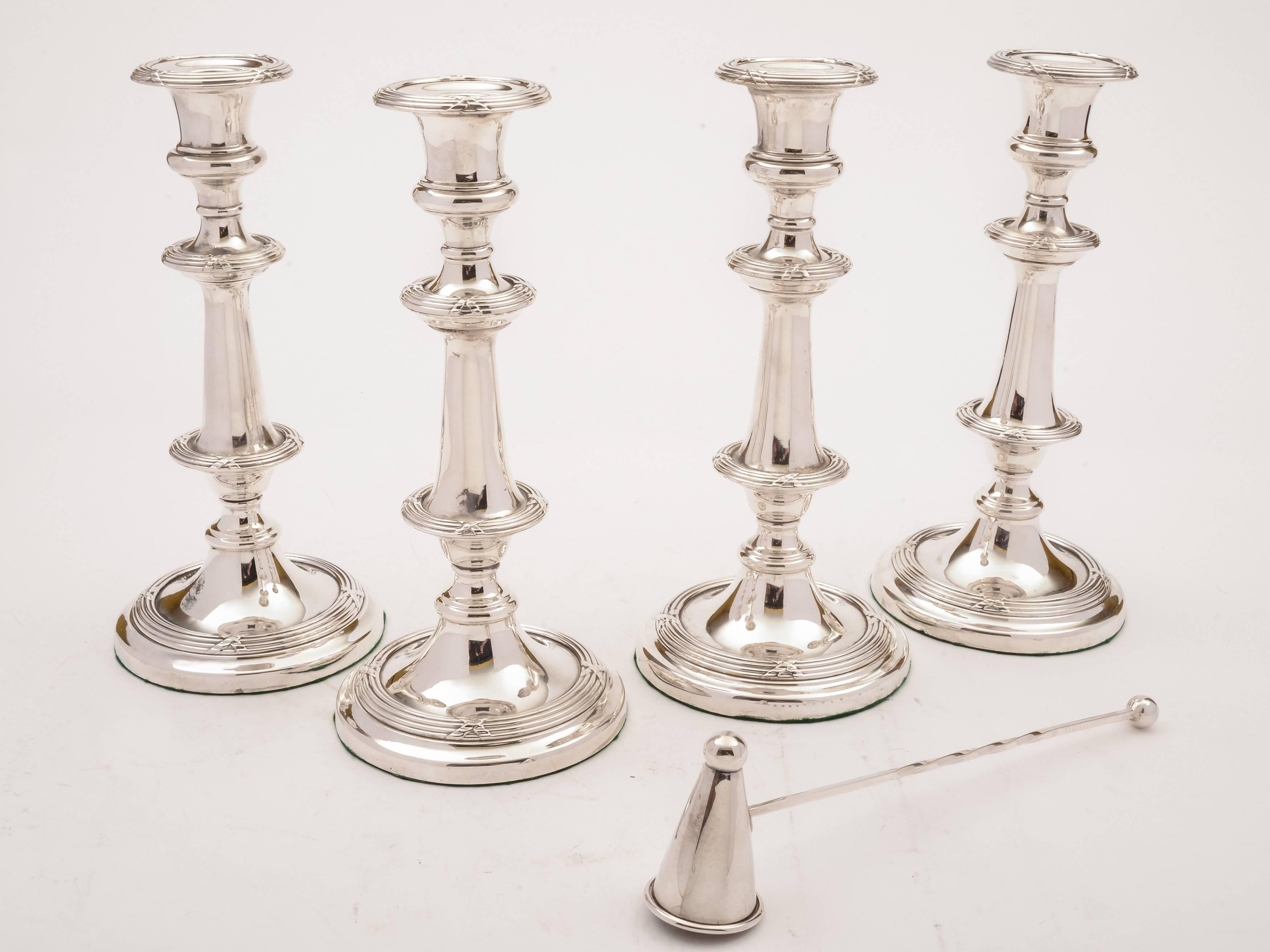 A stunning set of four English Victorian silver plated matching candlesticks with embossed decoration, detachable drip-trays for ease of cleaning and candle snuffer. circa 1890.



Measurements:
Height: 9
