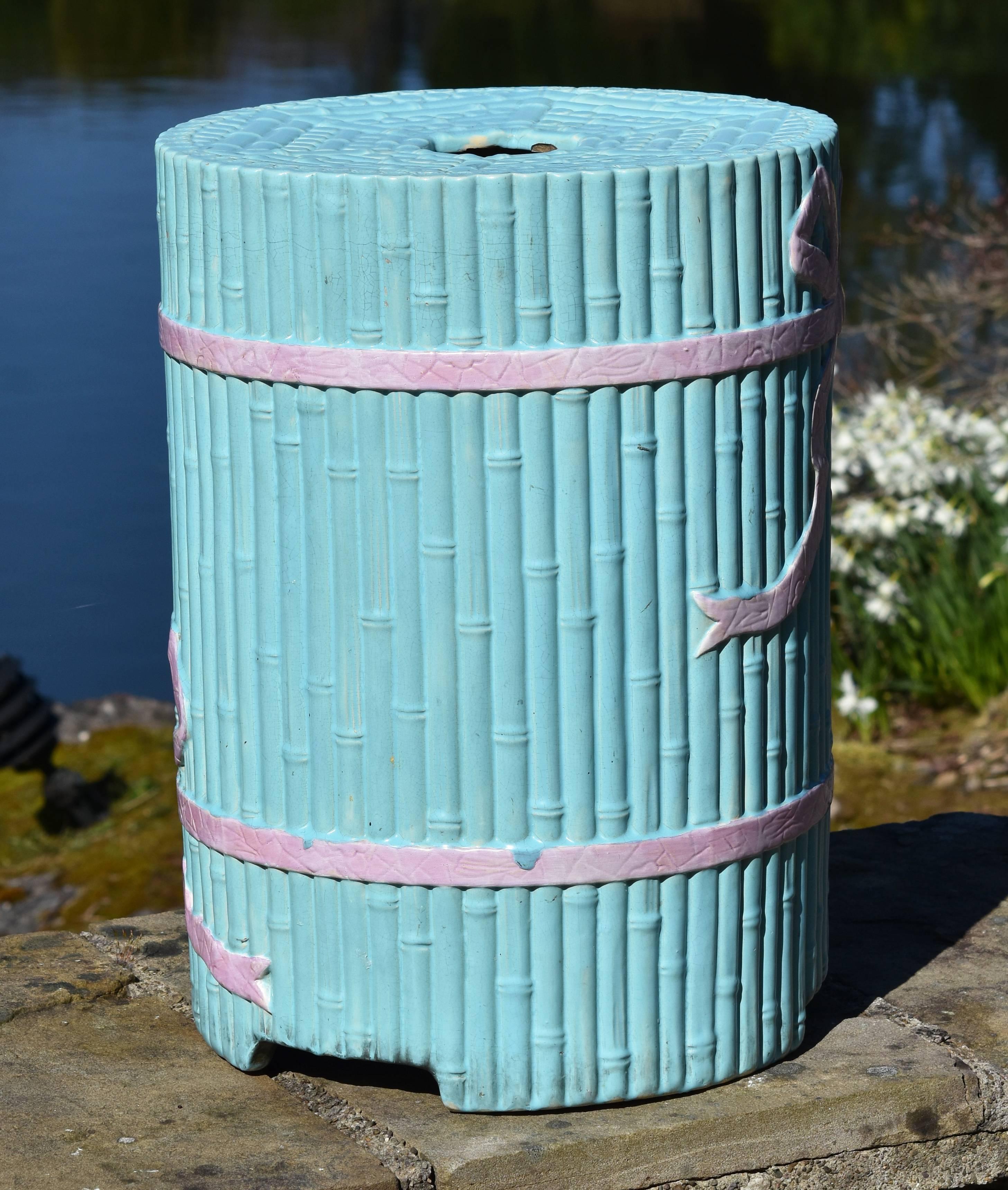 A rare turquoise ground Minton Majolica garden seat, circa 1860 modelled as upright bamboo cane bound together by two pink ribbons tied in bows.
Traditionally in China, harvested bamboo canes were stored upright and bound with ribbon hence this