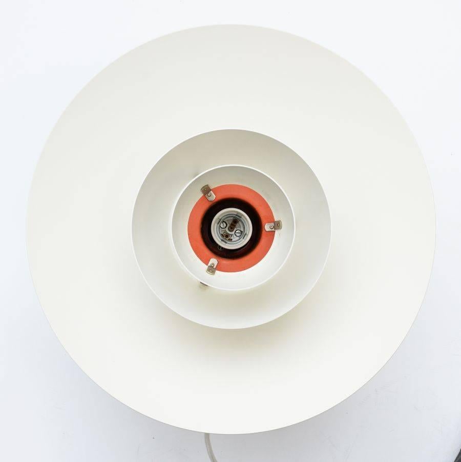 The PH4/3 lamp was designed by Poul Henningsen and produced by Louis Poulsen. This pendant lamp is white on the outside and orange on the inside.
 
New electrics installed.
?
The shape has been kept in every detail as original.
