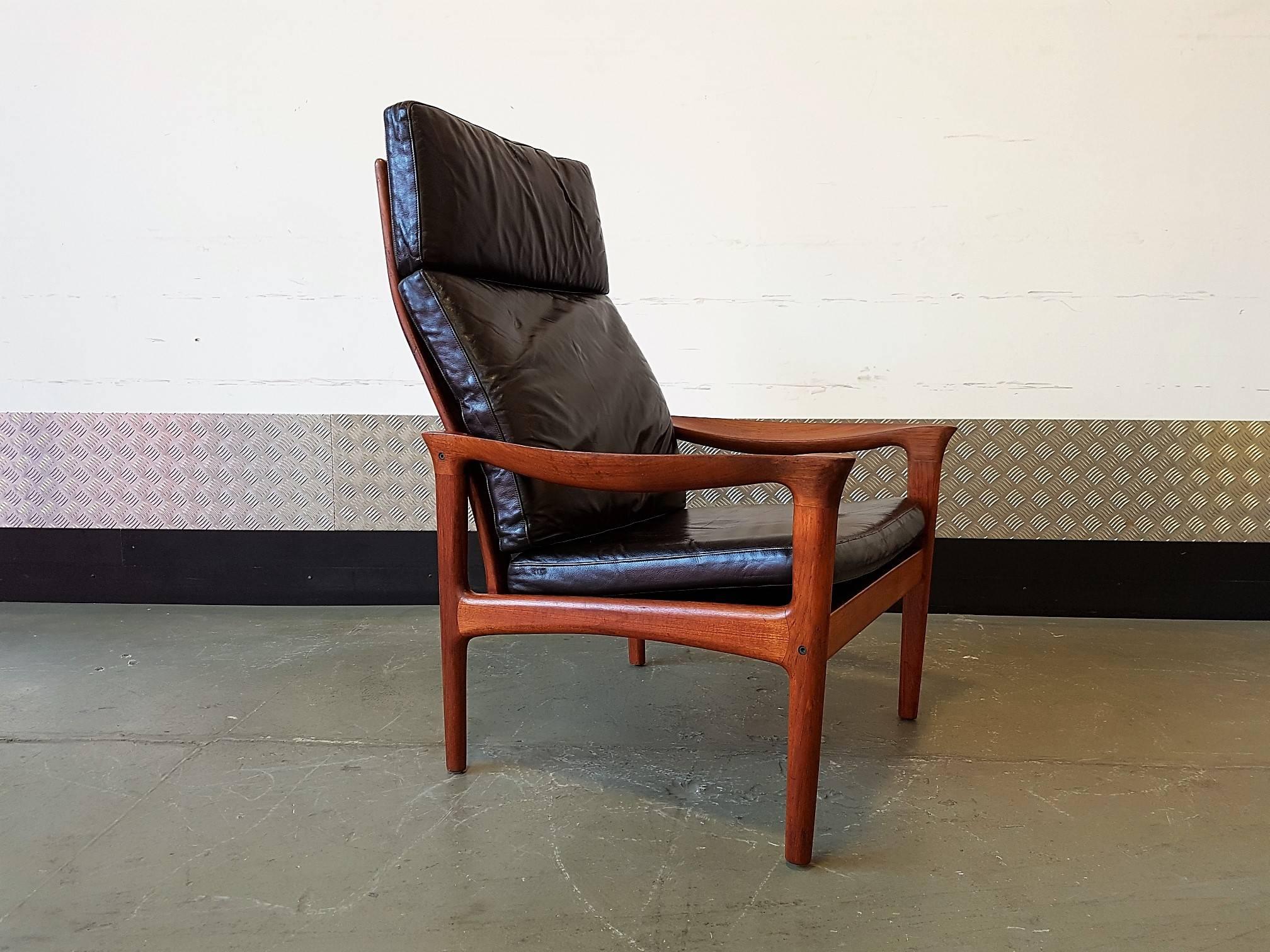 Very rare high back Glostrup teak wood armchair. Wood is in excellent vintage condition. Cushions are covered in original leather with visible signs of wear. 
 
The shape has been kept in every detail as original.