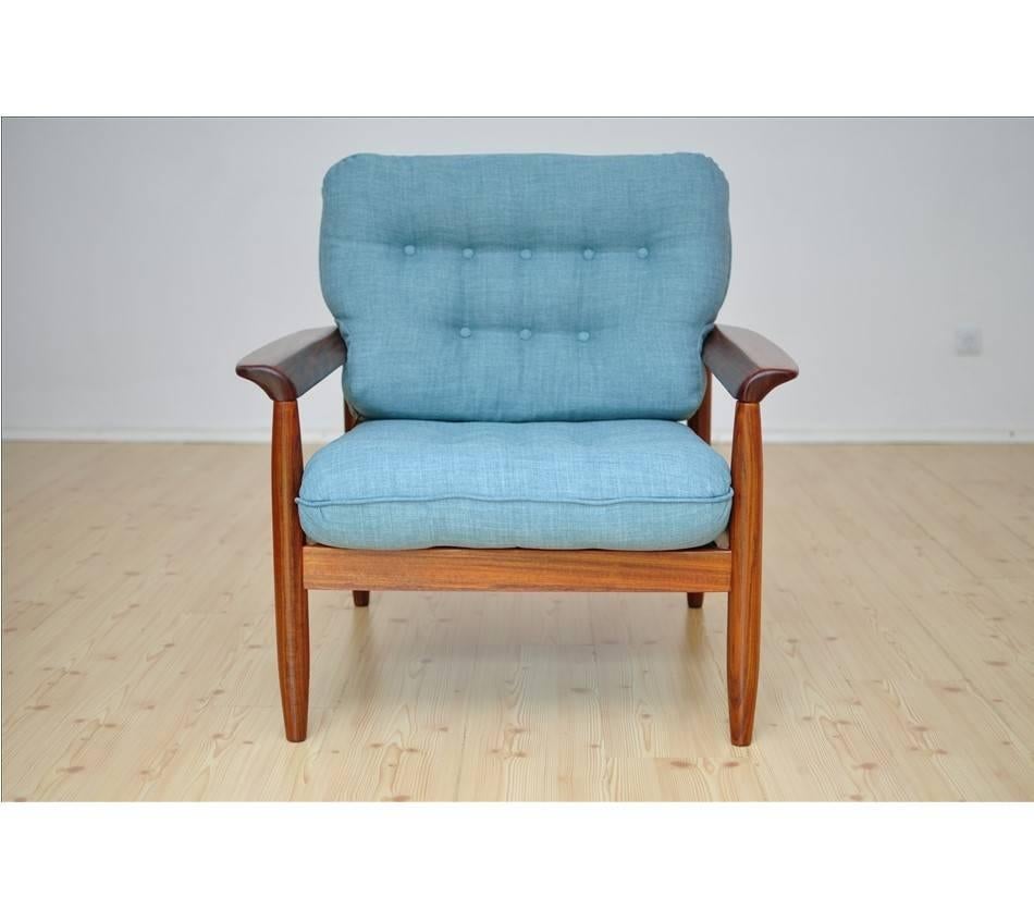 Price is per one armchair.
Two armchairs are available. 
 
Chairs have been fully restored, new cushions, new upholstery, wood has been sanded to the finest grit, restored and secured with Danish teak oil. Cushions come with zips for easy