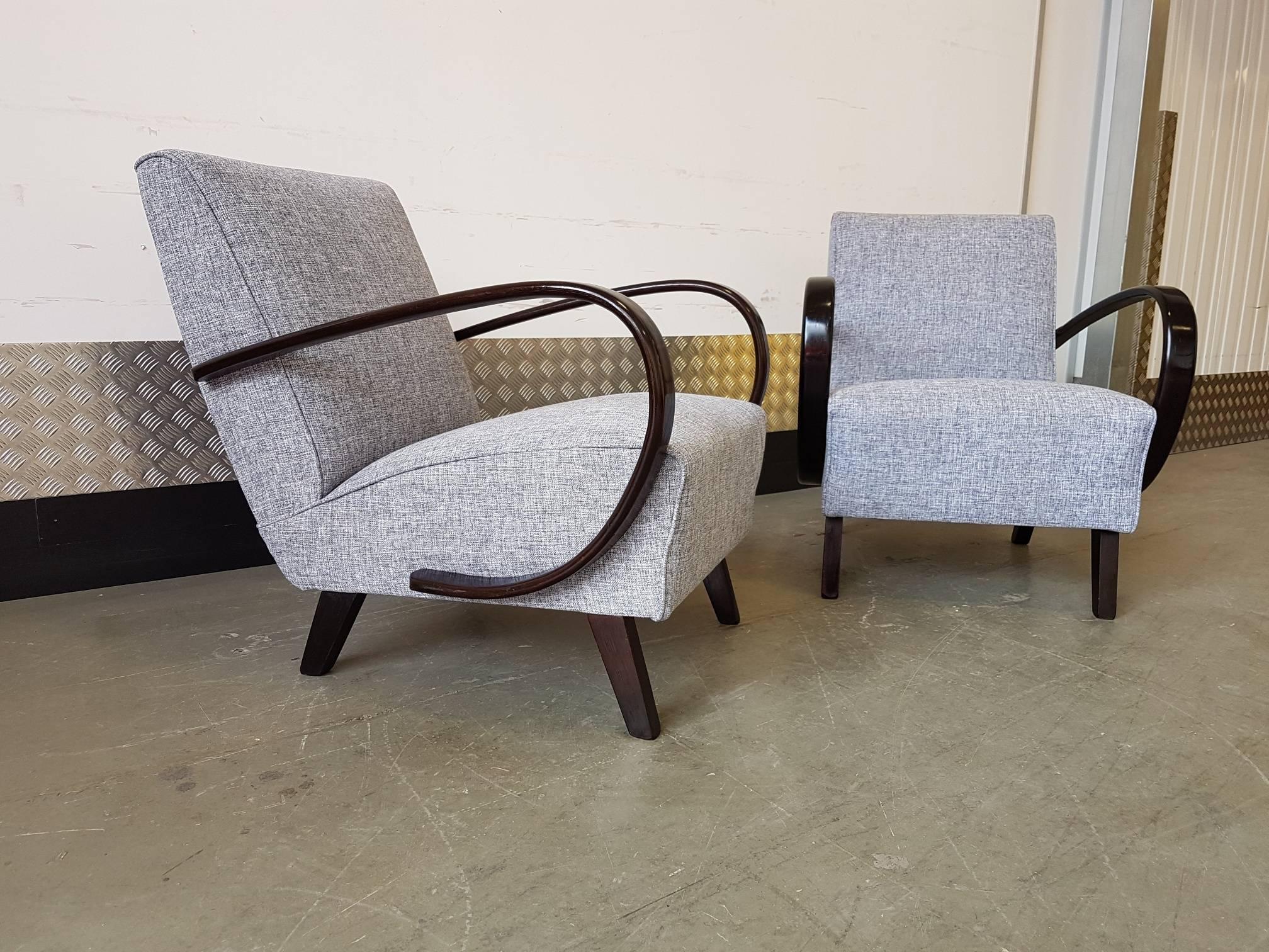 These beech bentwood armchairs originate from the 1930s. They have been traditionally re upholstered with seat springs and Grey Tweed upholstery.