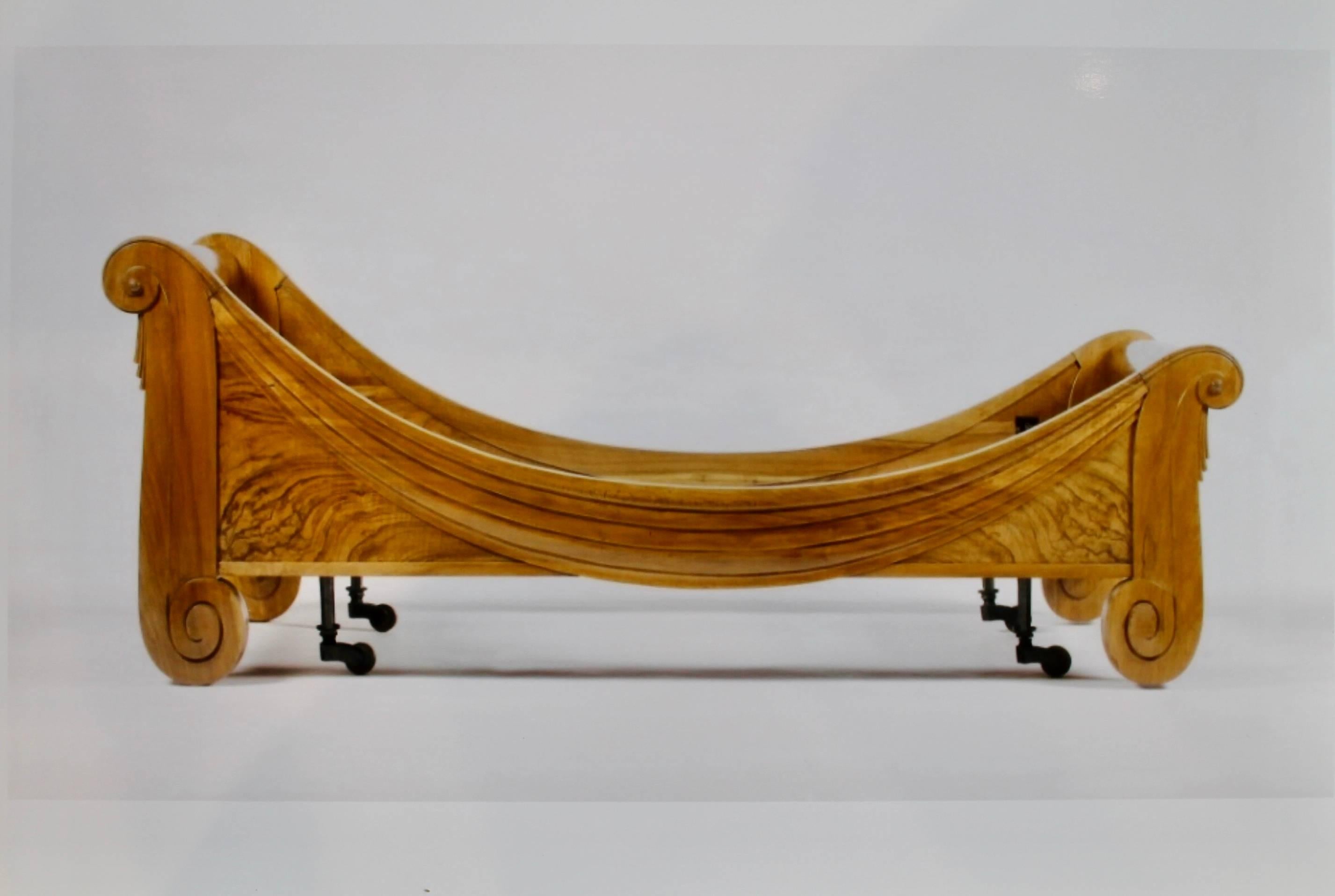 The frames of solid and veneered burr walnut carved with drapes.

Literature: Florence Camard, Sue et Mare et La Compagnie des Arts Francais, ed. de l'Amateur, Paris, 1993, page 108 for the design and page 288 for a period photograph of a bed of