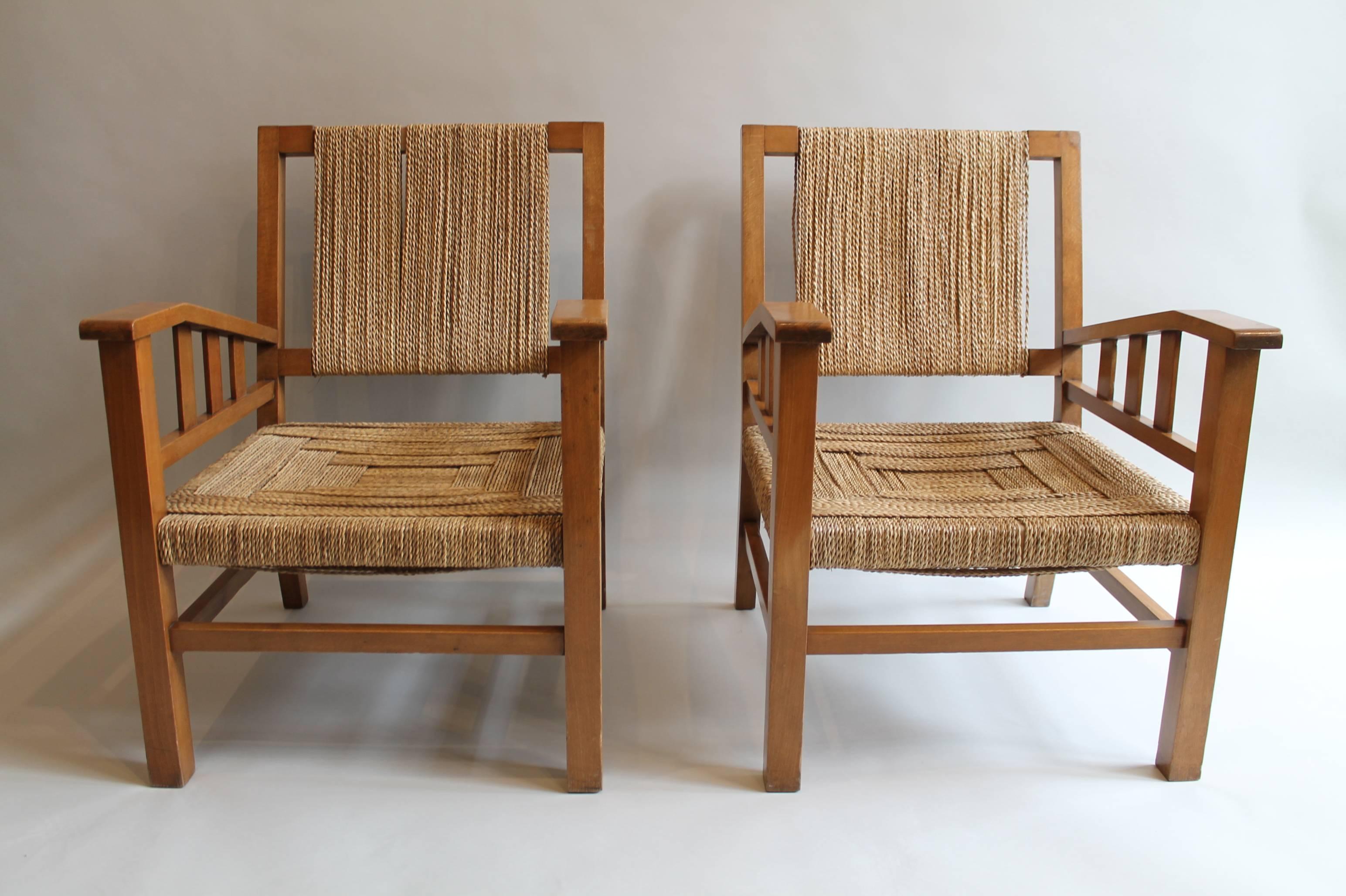 The wood frames with the seats and backs strung with twisted seagrass.