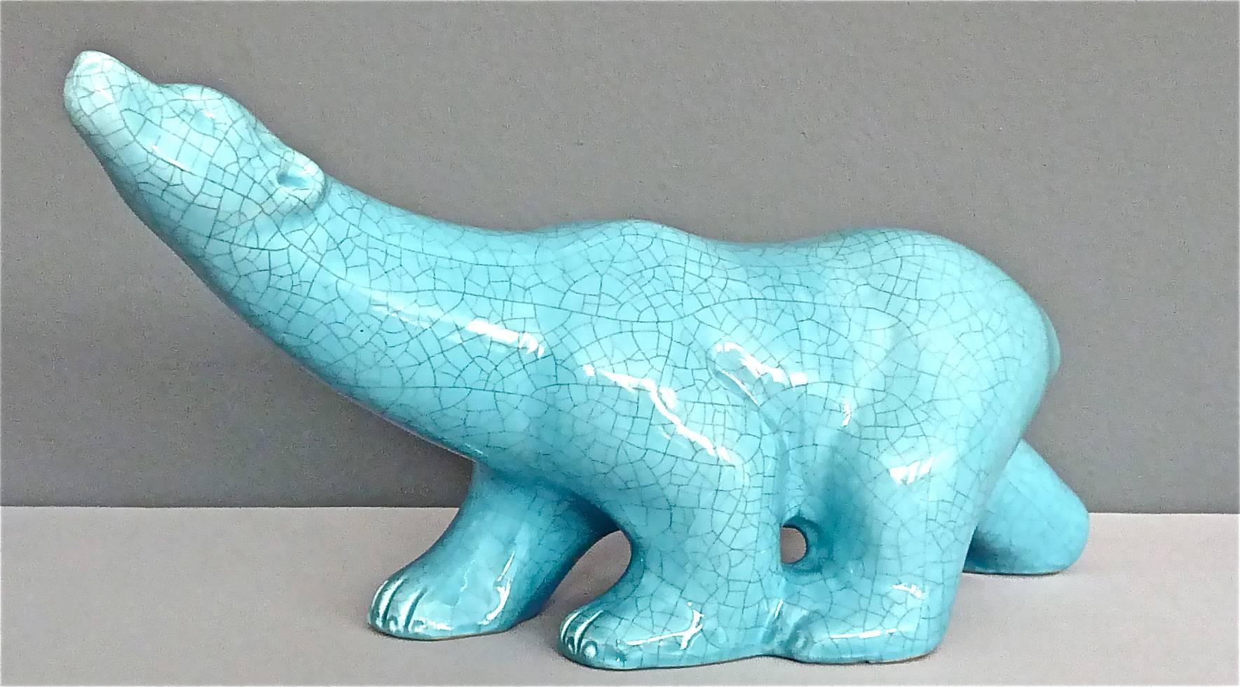 A large French light blue Art Deco crackle ceramic glaze sculpture of a striking polar bear inspired by the French artist and animal sculptor Franc¸ois Pompon. Marked LV Ceram at the bottom, the beautiful sculpture which can be dated around 1925-30