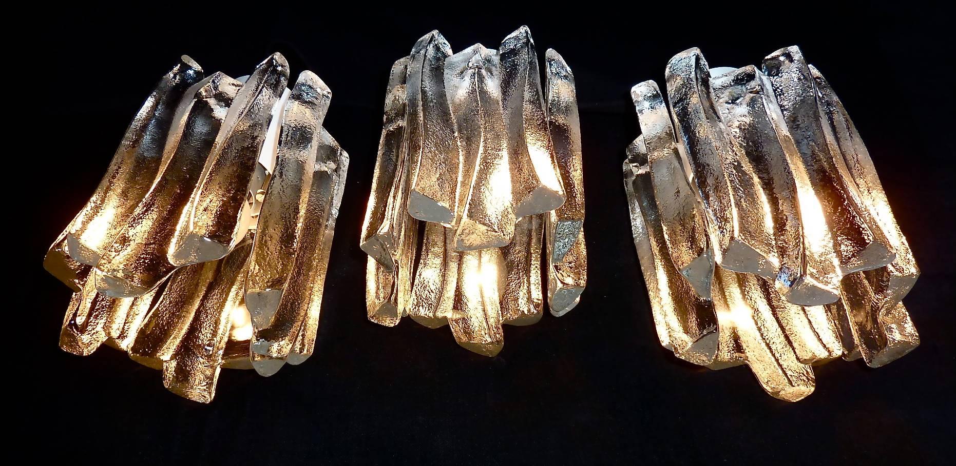 Stunning set of three Kalmar ice glass ceiling lamps, spots or lights designed and executed in Austria circa 1960. Each lamp has four good-weight frosted ice glass panels hanging on a white enameled metal fixture for one E27 standard screw bulb to