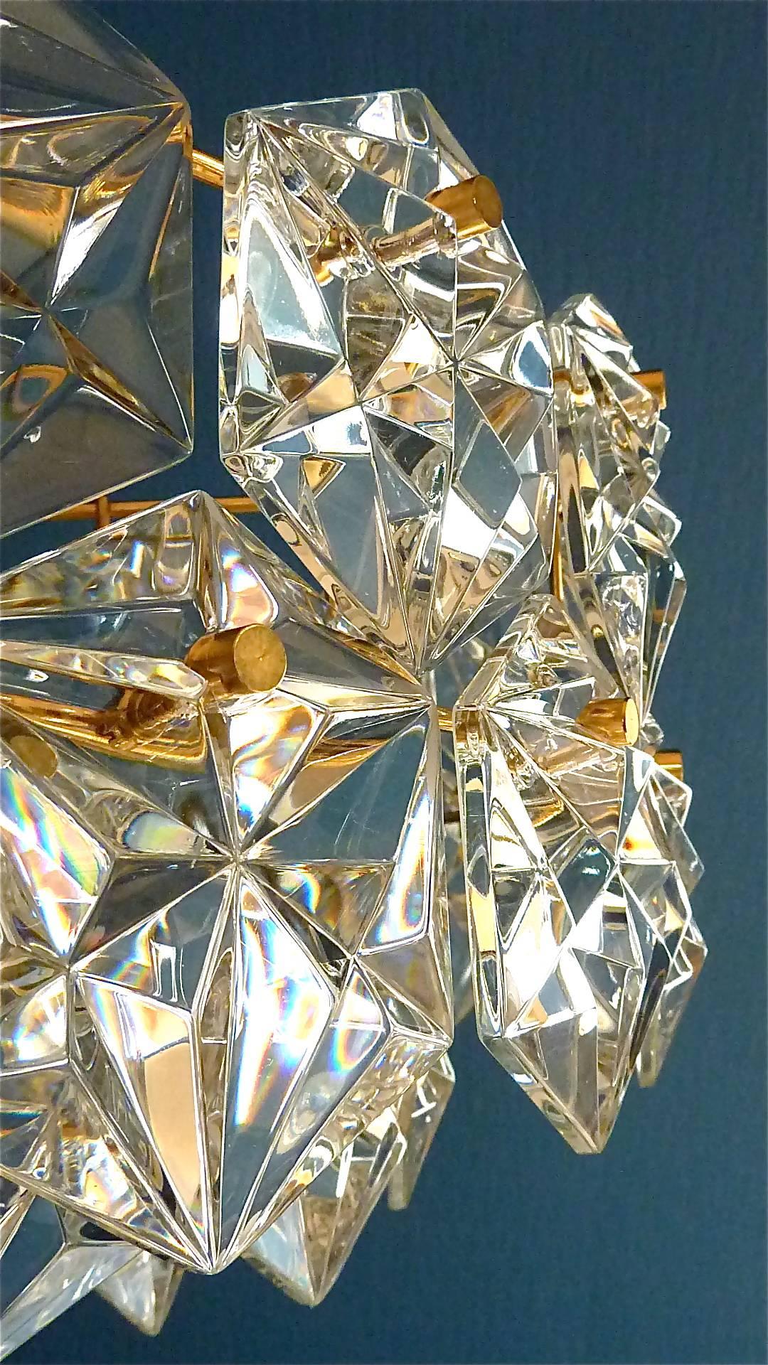 Large gilt Mid-Century Modernist Kinkeldey chandelier made in Germany, circa 1960-1970. It has 66 hexagonal diamond-shape faceted glass crystals, each 9 x 9 cm / 3.54 x 3.54 in. mounted on a five-tier gilt brass metal fixture. It needs 6 x E14 and 1