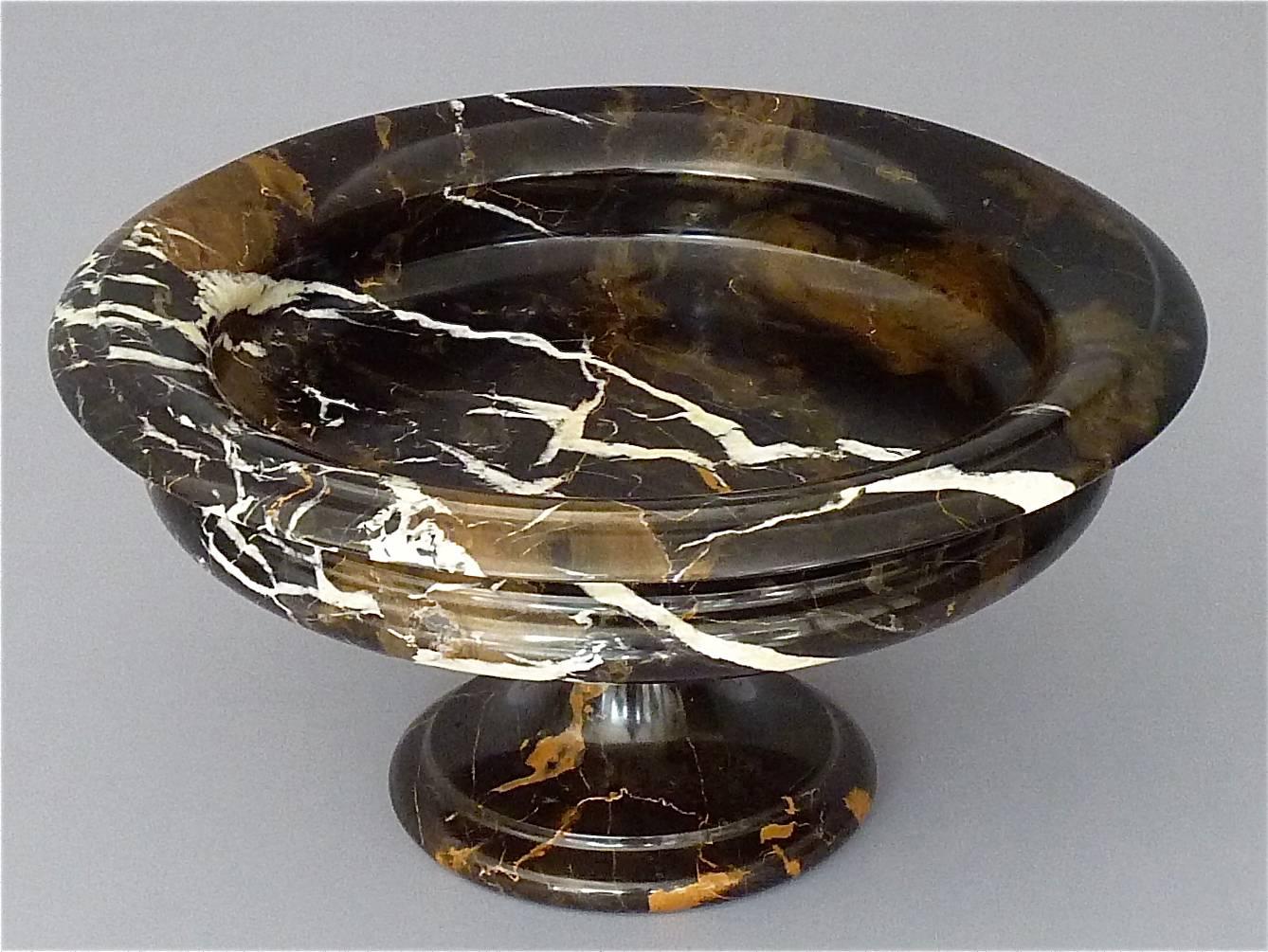 Beautiful antique neoclassical centerpiece or tazza which is a bowl mounted on a pedestal with veining in black, white and brown marble, Italy 19th century, circa 1880-1900. It is 19 cm / 7.48 inches tall and has a width of 36 cm / 14.17 inches. The