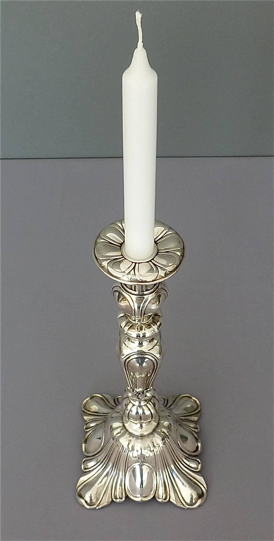 Precious pair of antique silver-plated Wmf candleholders / candlesticks in Baroque Style which can be dated Germany circa 1900. Each candleholder is marked at the rim of the stand with WMFM. WMF is an abbreviation for Württembergische Metallwaren