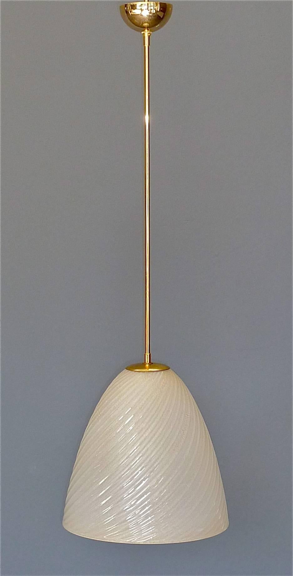 Large and fine handcrafted Murano art glass pendant lamp, Italy, circa 1950-1960 by Archimede Seguso for Seguso Vetri Dárte. The big dome-shaped glass body has a width of 32 cm / 12.60 inches. and is 32 cm / 12.60 inches. tall. It is made of ivory
