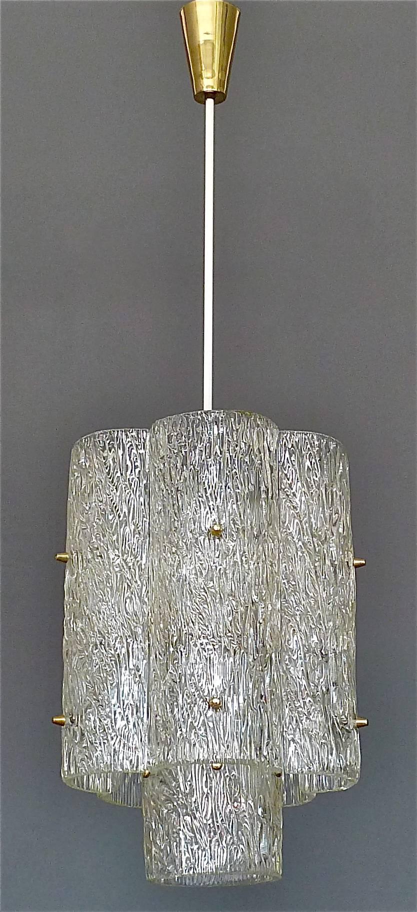 Very rare and large J.T. Kalmar Austria chandelier with textured murano glass, white lacquered metal and patinated brass details executed in the 1950s in Austria. The modernist chandelier has 5 bent textured crystal glass panels and a center ring