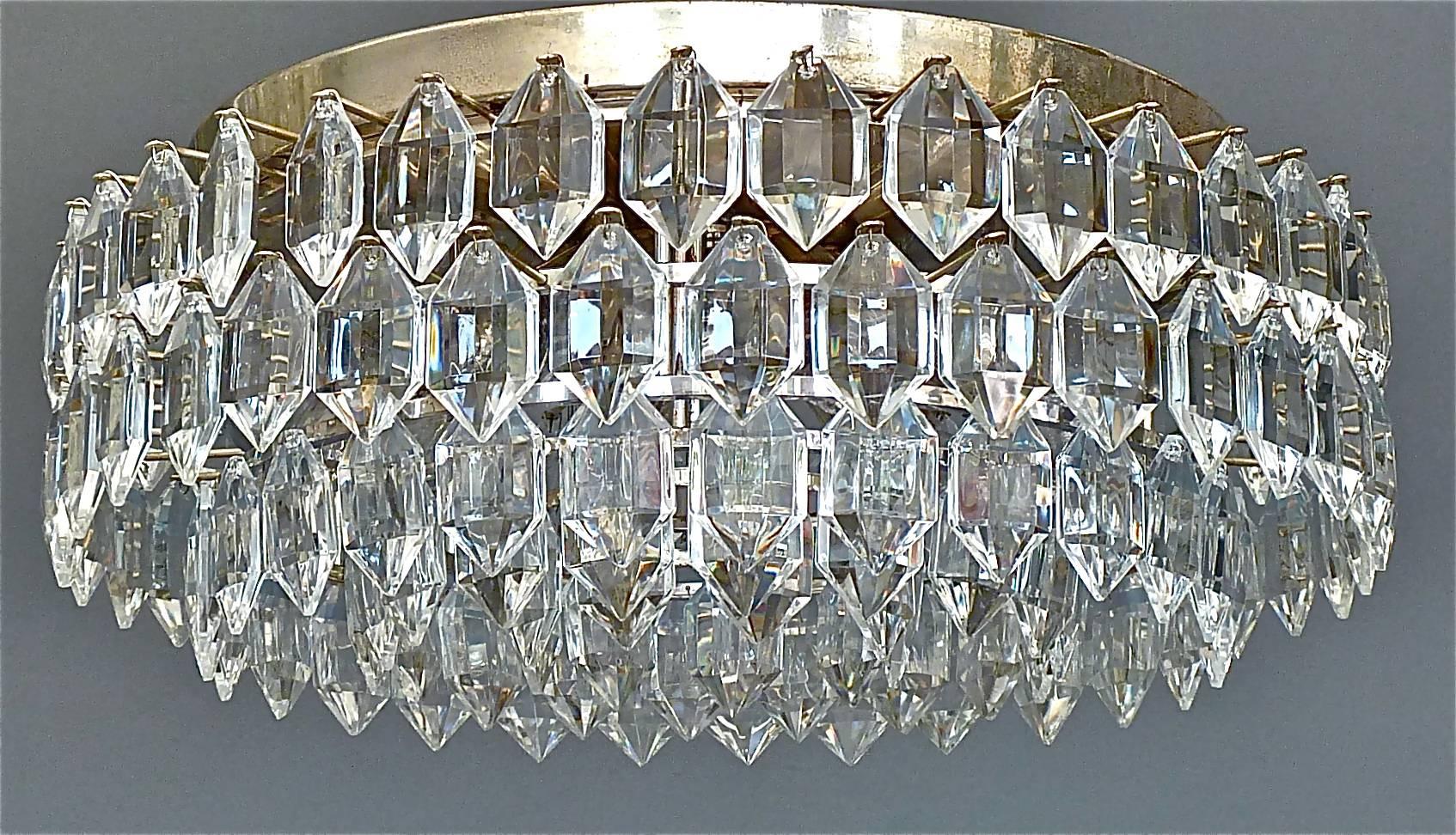 Modernist crystal glass flush mount or ceiling chandelier made by the famous company Bakalowits, Vienna, Austria, circa 1960. The multi-tier fixture and frame are made of silvered brass with lots of faceted gem-like crystal glass beads. It has six x