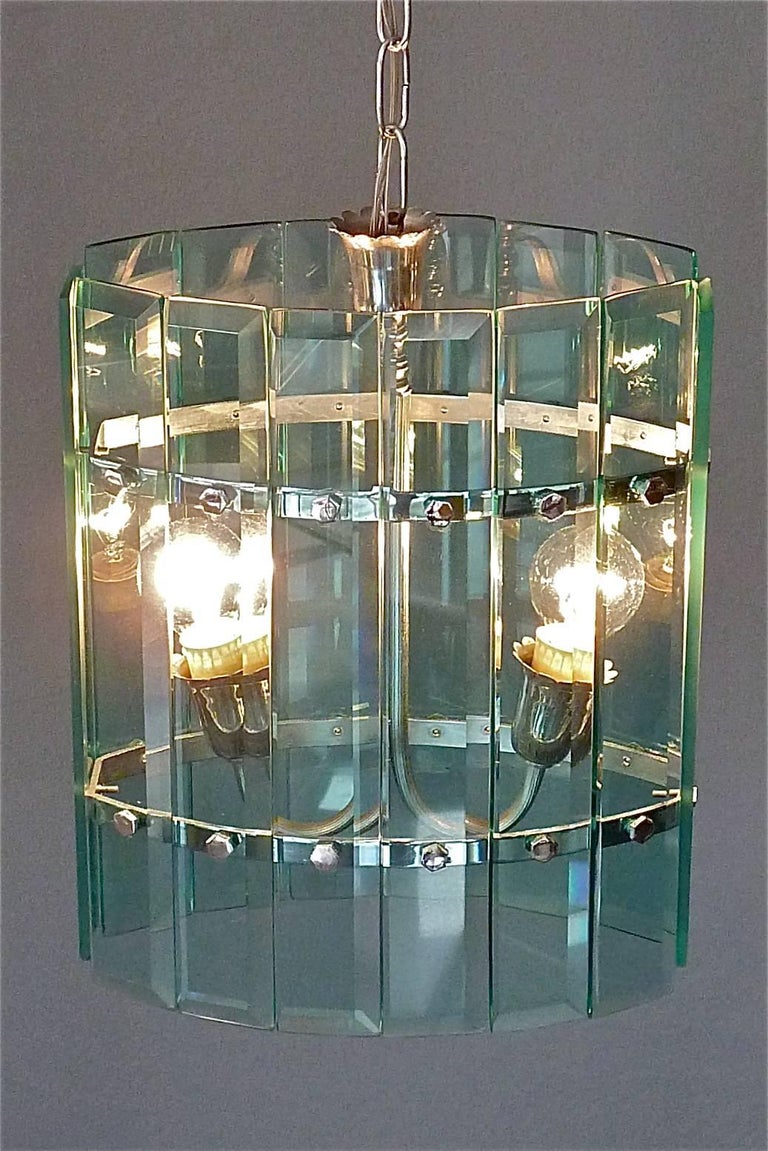 A rare Italian chain hanging green faceted and beveled glass panel chandelier, lantern or pendant with nice chromed metal details attributed to Pietro Chiesa for Fontana Arte, Italy circa 1940s. The newly wired 2-light oval shape pendant takes two