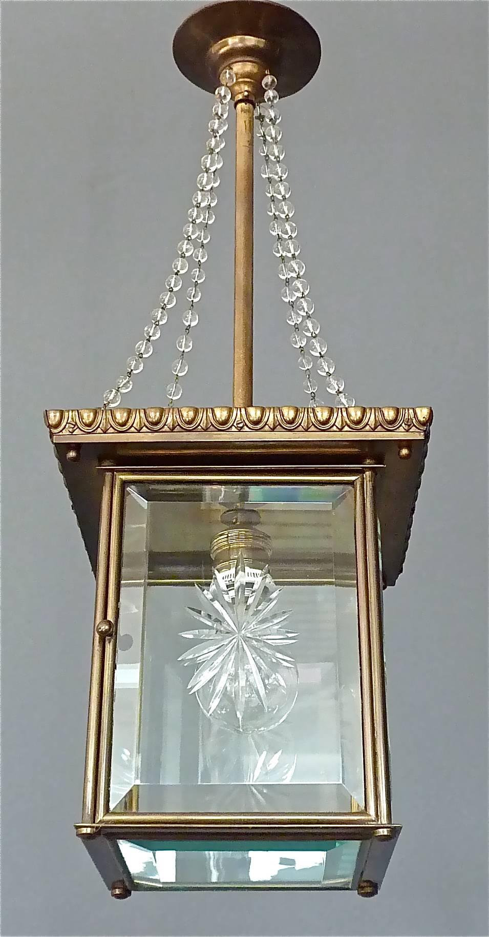 Signed Vienna Secession pendant lamp or lantern, Austria, circa 1905. Antique patinated brass metal lamp corpus with nice Art Nouveau / Jugendstil details, glass pearl strings which come from the canopy, hinged door with impressed XX, unidentified