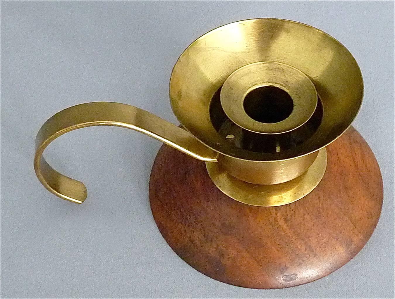 Rare authentic brass and wood candleholder light designed by Marianne Brandt, circa 1929-1932 and which was manufactured by Ruppel Werke, Gotha in Germany. The candleholder is 7.5 cm / 2.95 inches tall and has a width at the wood base of 12.2 cm /
