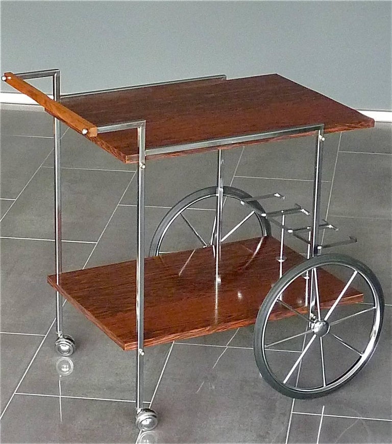 Amazing modernist bar cart, drinks or serving table or trolley designed by Walter Wirz for Wilhelm Renz, confirmed by Eckart Renz, Germany around 1968-1972. It is made of tubular square chromed brass metal, beautiful Brazilian Rio rosewood laminate