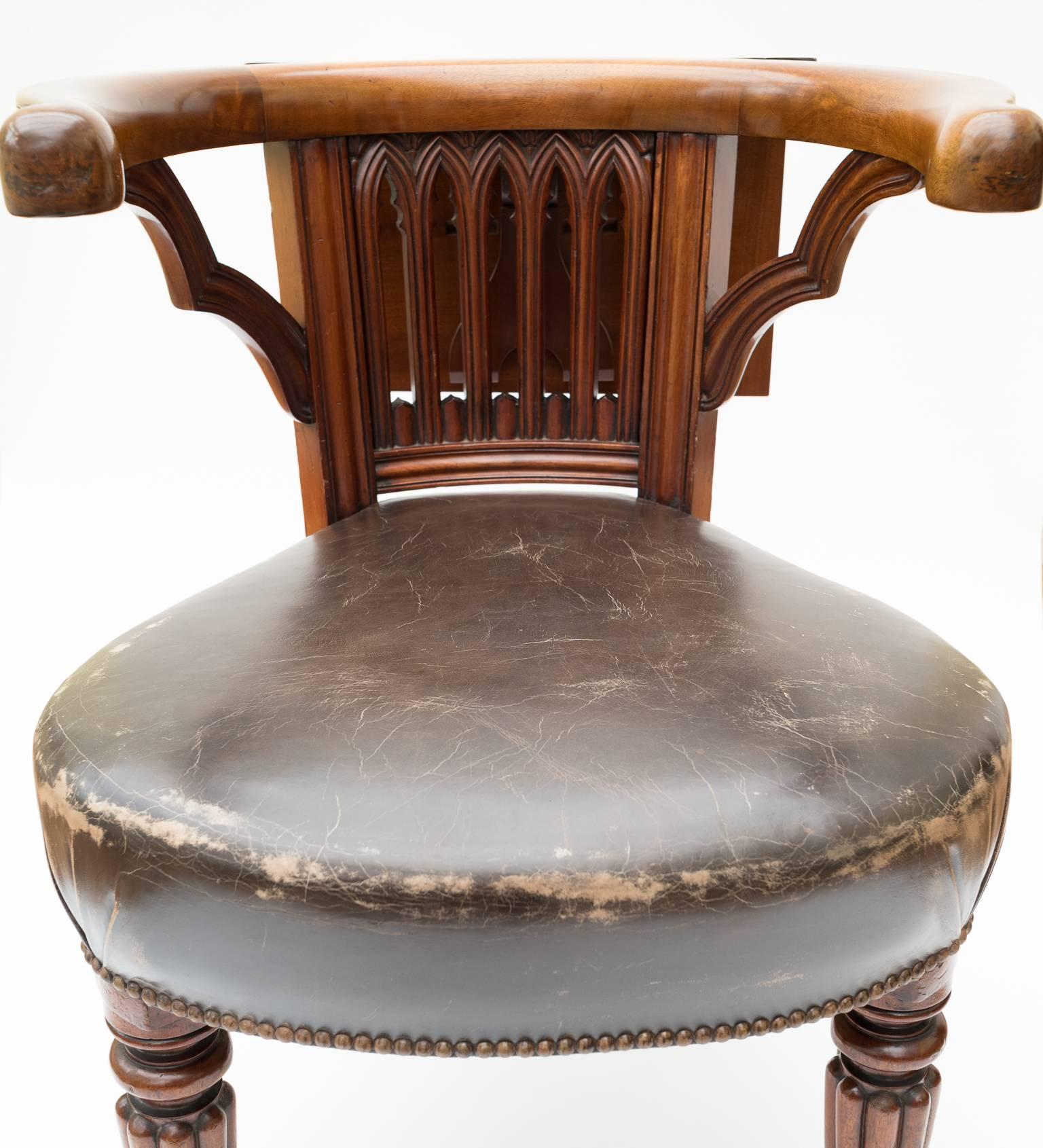 A wonderful example of an early 19th century Georgian brass-mounted mahogany library chair which is also sometimes referred to as a cockfighting chair. 

The reading slope can slide around the rear of the chair via the brass track enabling the