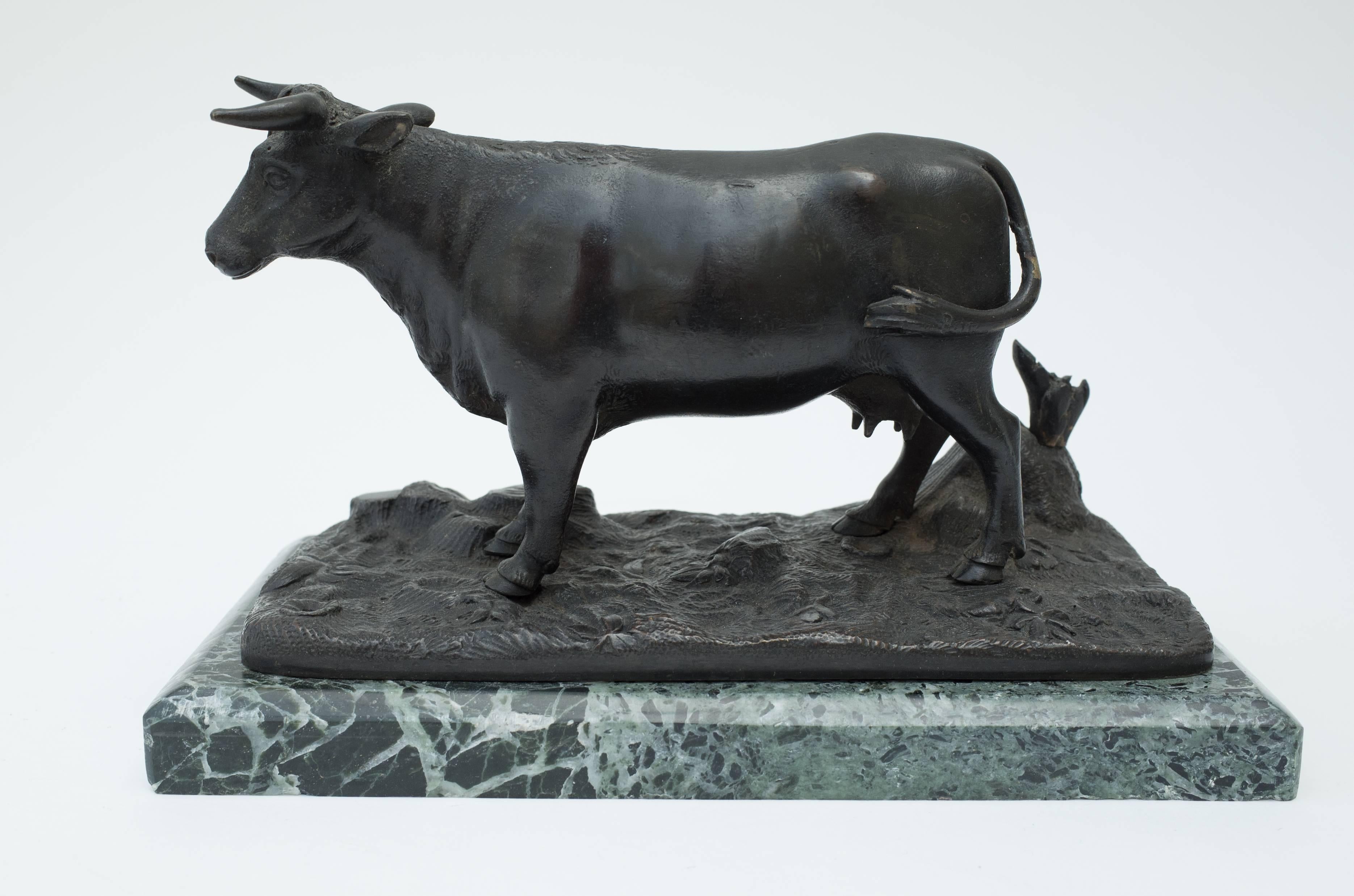 A fine pair of 19th century bronzes depicting a bull and a cow on green marble bases.

 