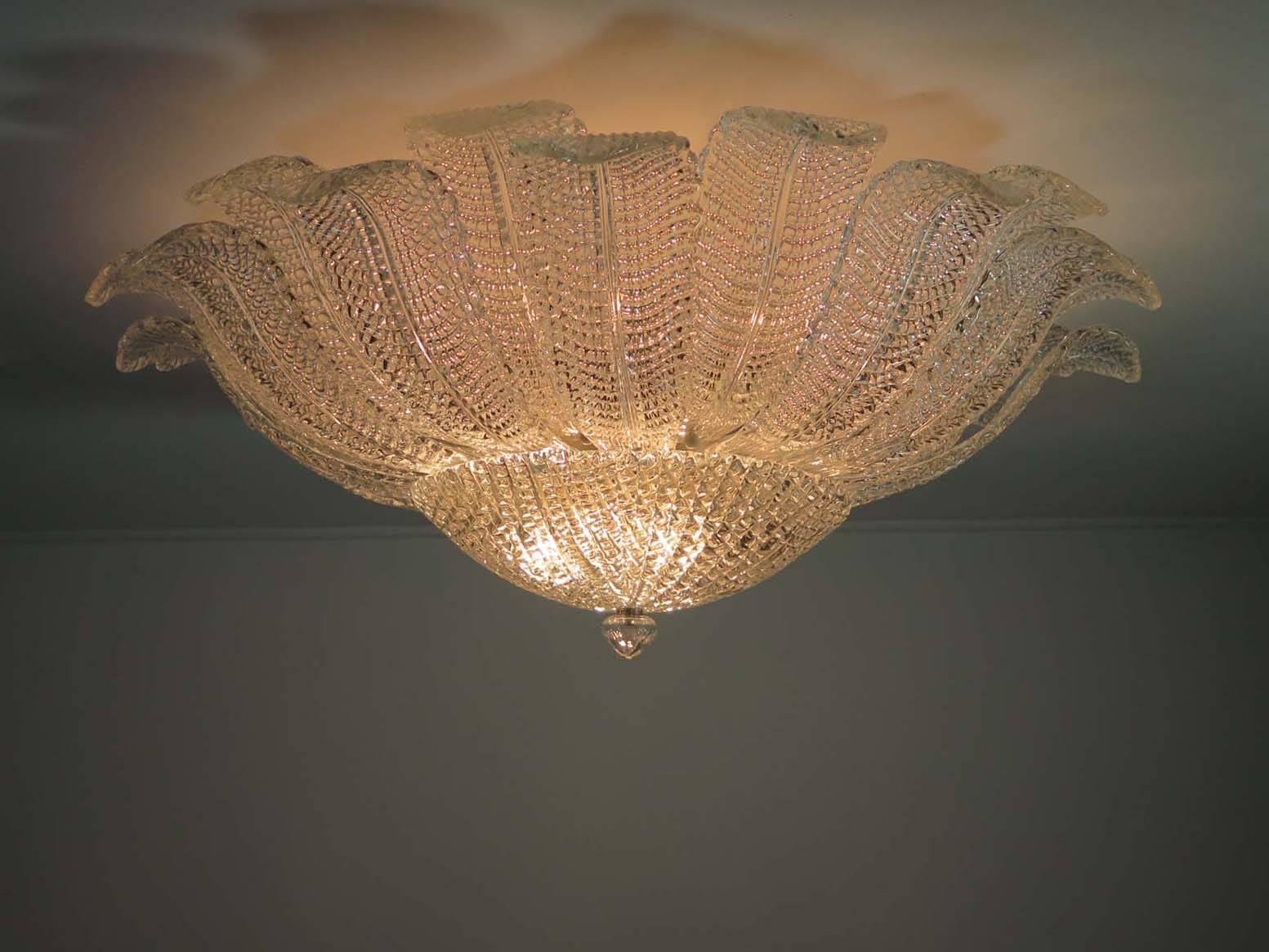 Fantastic and fabulous of vintage Murano Italy art glass ceiling light. The rare lamp is made of 24 mouth-blown hand-formed leaf-form clear glass panels plus a huge glass as a bottom.This beauty has the look of a precious big flower. Especially when