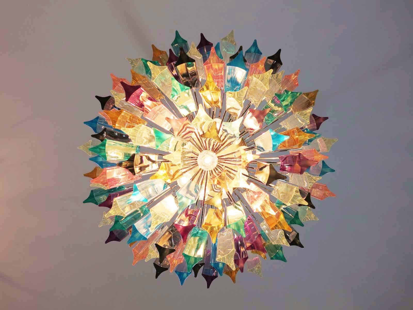Fantastic vintage Murano chandelier made by 107 Murano crystal multicolored prism in a nickel metal frame. The glasses are transparent, blue, smoky, purple, green, yellow and pink.
Period: 1970s
Dimensions: 55.10 inches height (140 cm) with chain;