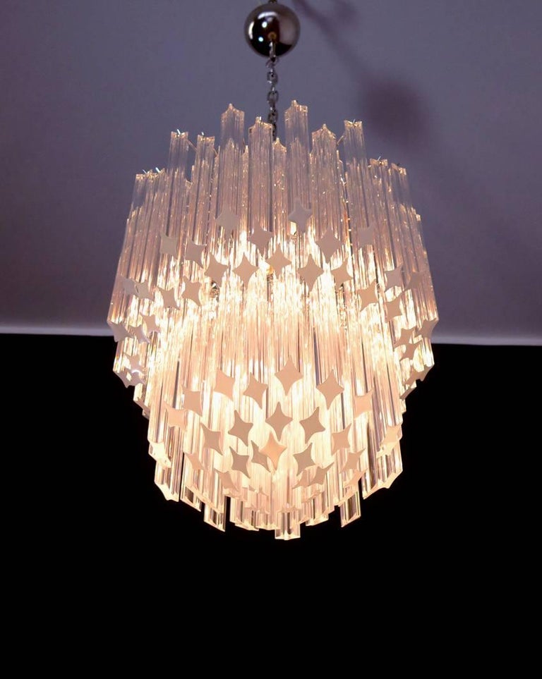 Fantastic and big Murano chandelier made by 107 Murano crystal prism triedri in a nickel-plated metal frame.
Period: late XX century
Dimensions: 51,20 inches height (130 cm) with chain; 25,60 inches height (65 cm) without chain; 18,50 inches