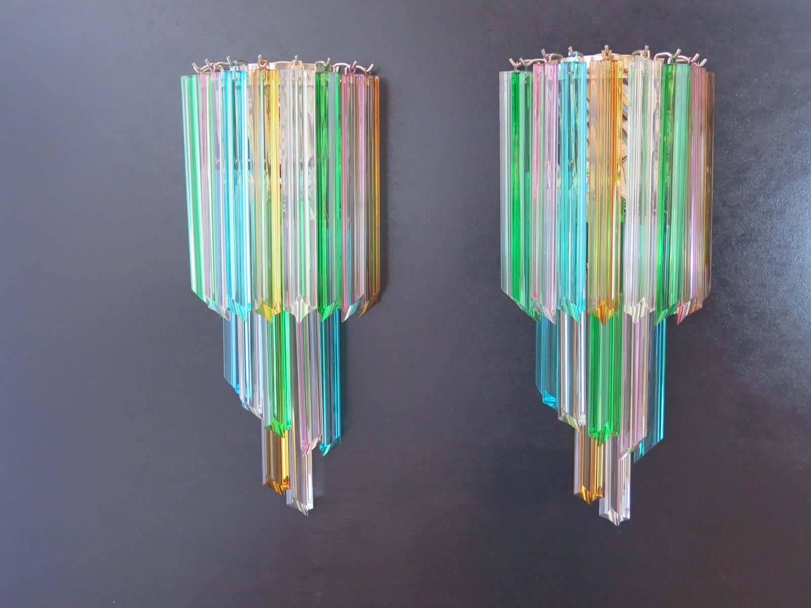 Fantastic pair of vintage Murano wall sconce made by 16 Murano crystal prism (quadriedri) for each applique in a chrome metal frame. The shape of this sconce is spiral. The glasses are transparent, blue, smoky, purple, green, yellow and