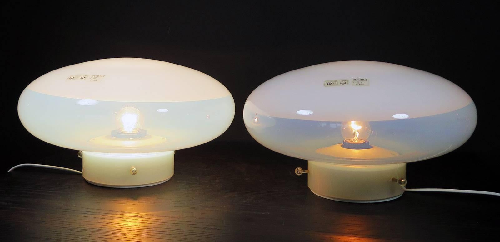 This original pair of Gill Lamp was designed by Roberto Pamio for Leucos, Italy in 1962. It consists of Murano opaline glass with a white plastic base and can be used as a ceiling lamp or as an applique. It is in excellent vintage