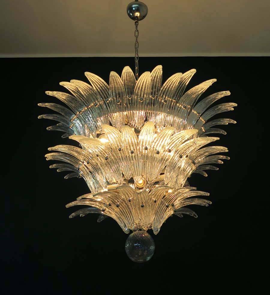 Palmette ceiling light made by 94 Murano crystal glasses in a metal frame. The chandelier has also a Murano glass ball in the end of the lamp.

Period: 1980s

Dimensions: 67 inches (170 cm) height with chain; 27,50 inches (70 cm) height without