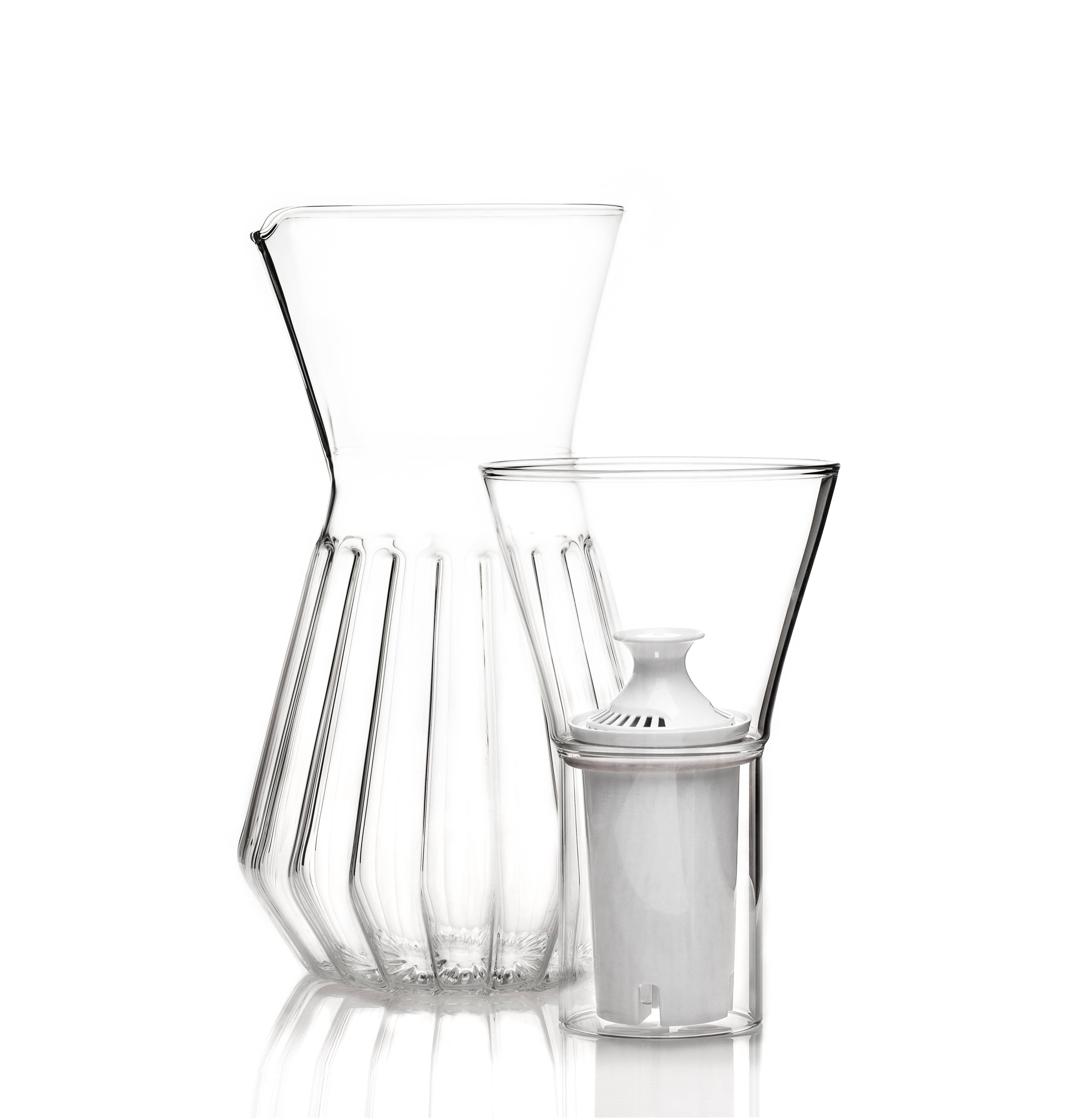 This set includes one Fluted Talise pitcher carafe and six Mixed Small Glasses. 

With a special technique that blends two types of glass, the fluted talise can be used with the funnel for water or without for non-filtered beverages. Made without