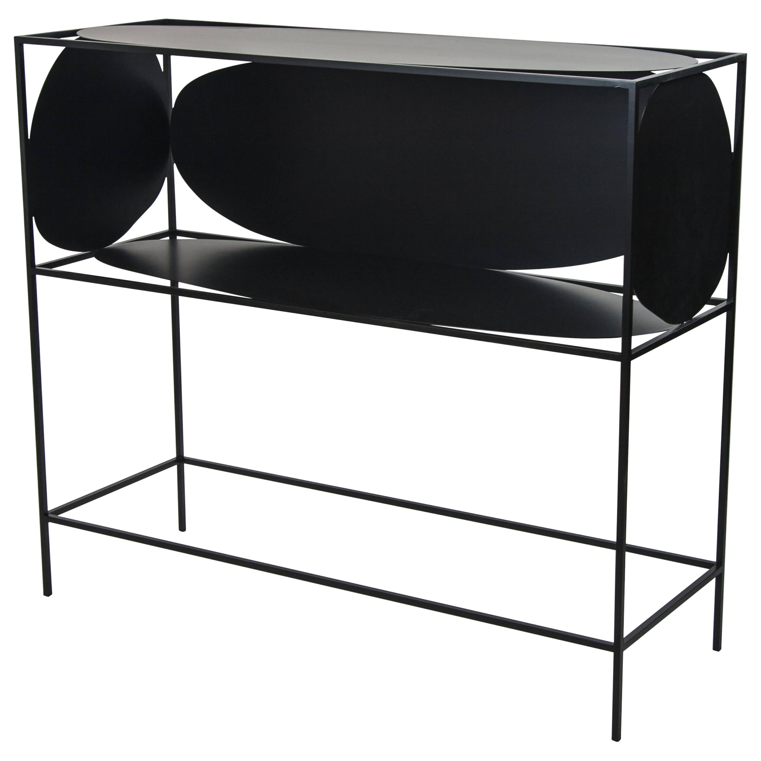 A study in positive and negative space, the modern contemporary black steel metal Ahn credenza bar or buffet is ever changing depending on how it is positioned and viewed in a room. With its five different asymmetrical and organic surfaces, Ahn is a