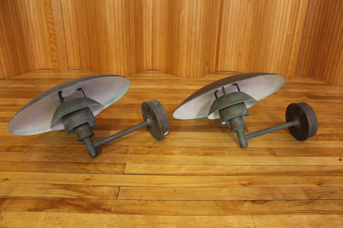 Pair of Poul Henningsen PH4.5/3 copper wall lights, manufactured by Louis Poulsen, Denmark, 1966. Designed originally for exterior use. These came from the same house and the copper has weathered evenly so they have the same patina.

A great