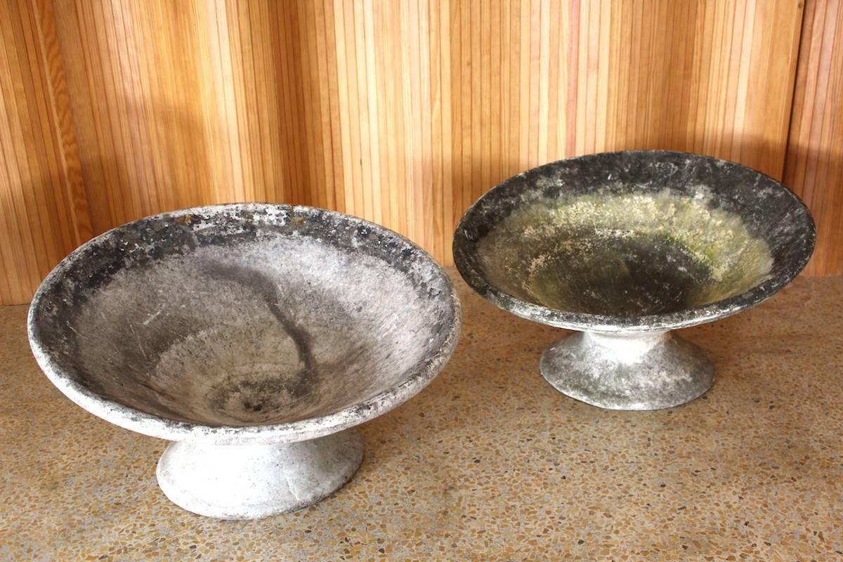 Pair of concrete garden planters designed by Willy Guhl and Anton Bee - manufactured by Eternit, Switzerland, 1950s.

Dimensions: Diameter 64cm; height 36cm at highest point; 26cm at front edge.

Excellent, original condition with lovely patina.