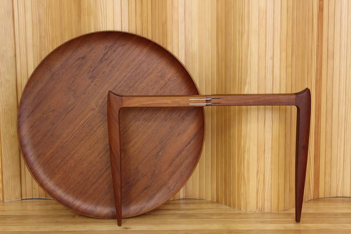 Teak tray table on folding teak base designed by H Engholm & Svend Aage Willumsen, manufactured by Fritz Hansen, Denmark, 1950s. Lovely quality and detailing.

Excellent, vintage condition. The teak is a lovely rich colour. Slight warping of the