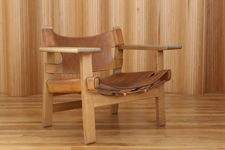 Description: Oak and leather 'Spanish' chair, model 226.

Designer: Børge Mogensen (1914-1972)

Manufacturer: Fredericia Stolefabrik, Denmark - original paper label to the underside (see photo).

Date: 1958

Dimensions: Width 82cm; depth