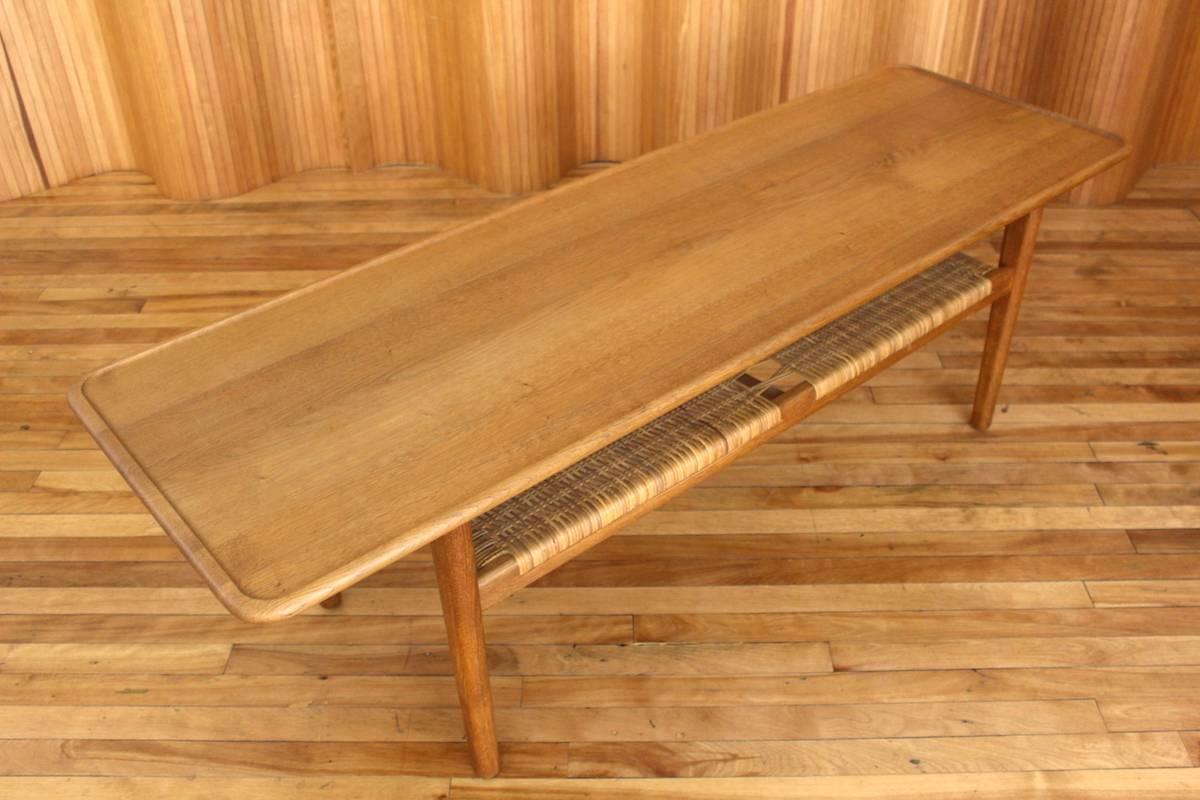 Description: Oak and rattan coffee table model no. AT-10

Designer: Hans J Wegner

Manufacturer: Andreas Tuck, Denmark

Date: 1950s

Dimensions: Length 161cm, depth 50.5cm, height 50.5cm.

Condition: Excellent, vintage condition. The solid